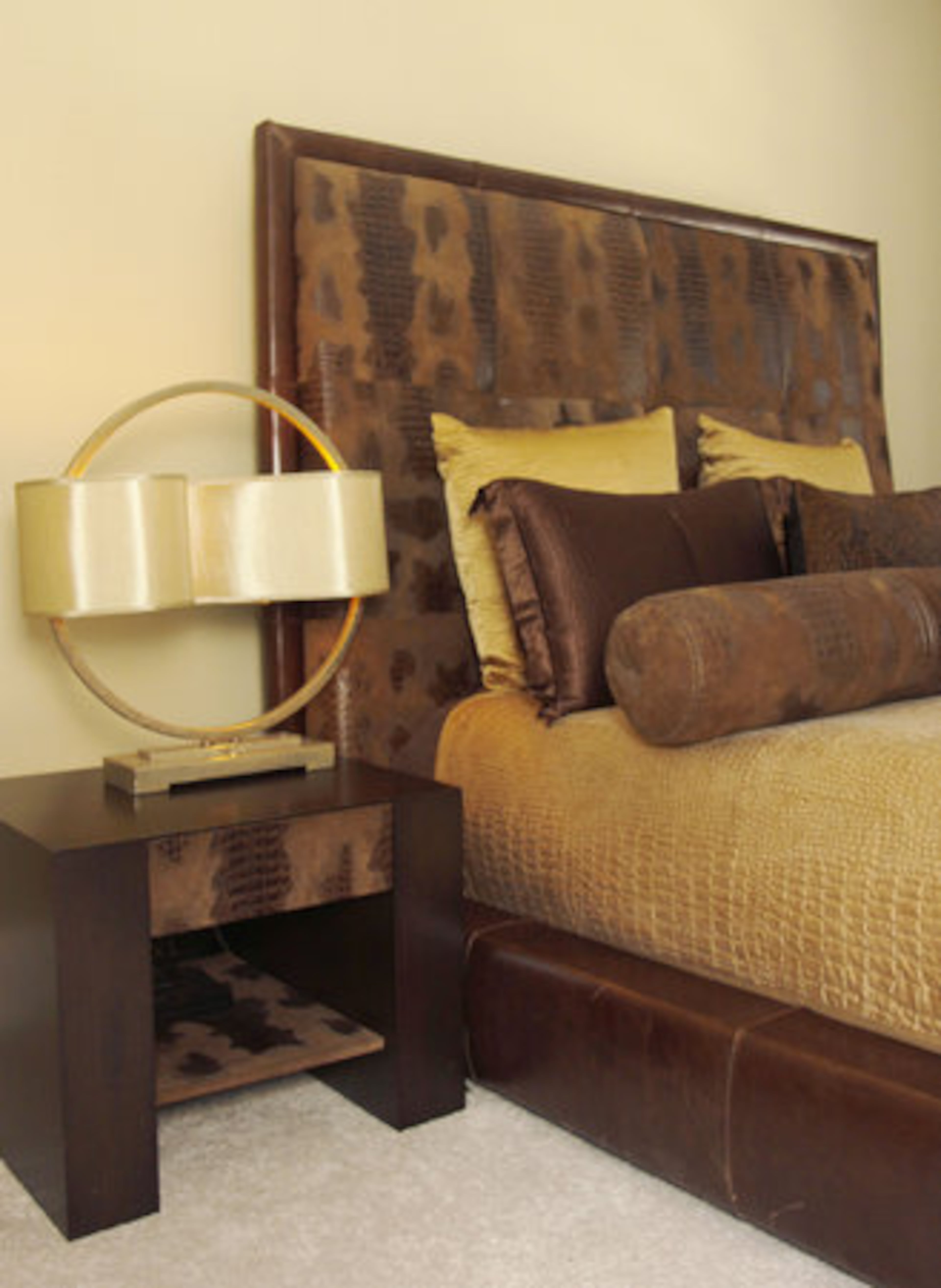 Kline says her home is a second showroom since all furniture, accessories and artwork came from her store. Pictured in a guest room is a contemporary leather bedroom suite with an embossed crocodile treatment.