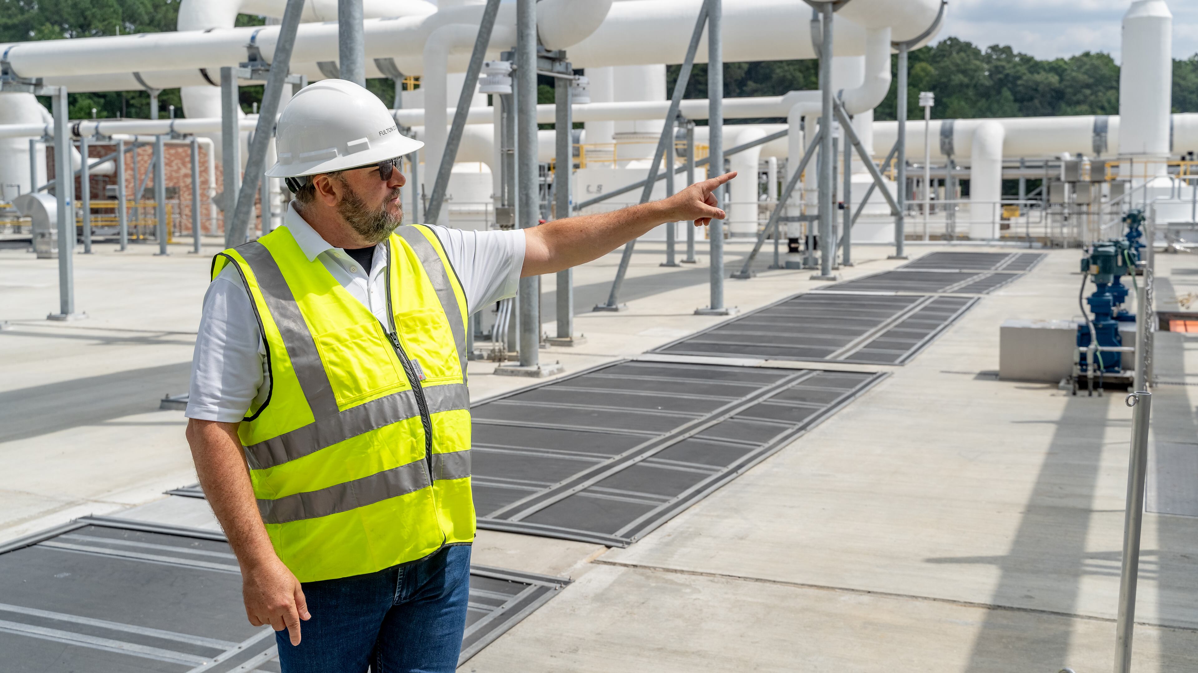 Fulton County Director of Public Works David Clark explains the aeration process. Fulton County officials toured the new water reclamation facility built on the grounds of the existing Big Creek Wastewater Treament center. Thursday, August 22, 2024 (Ben Hendren for the Atlanta Journal-Constitution)