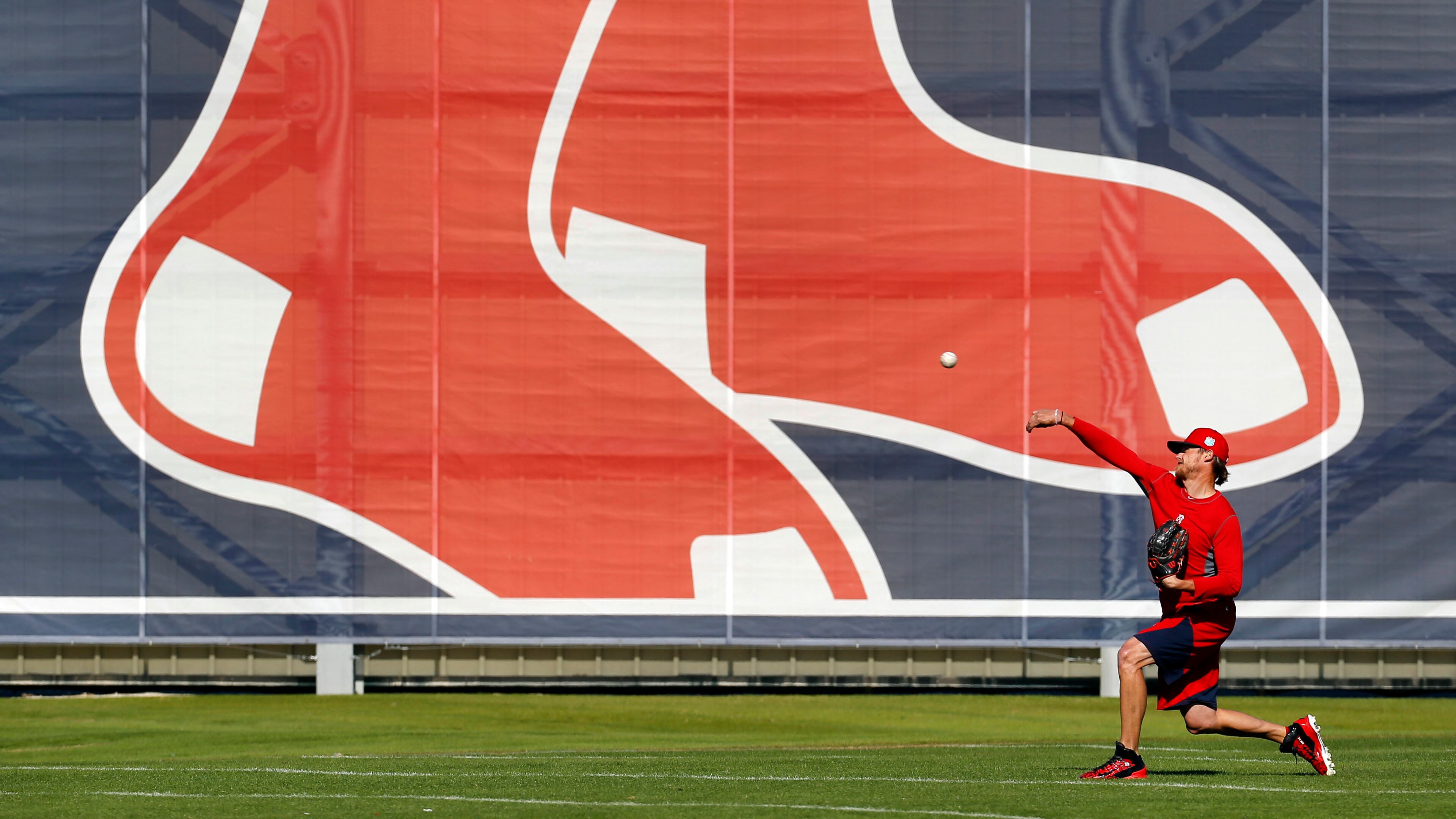 Boston Red Sox pitcher Clay Buchholz throws a pitch during a spring training baseball practice in Fort Myers, Fla., Thursday, Feb. 18, 2016. Red Sox pitchers and catchers hold their first official workout on Friday. (AP Photo/Patrick Semansky)