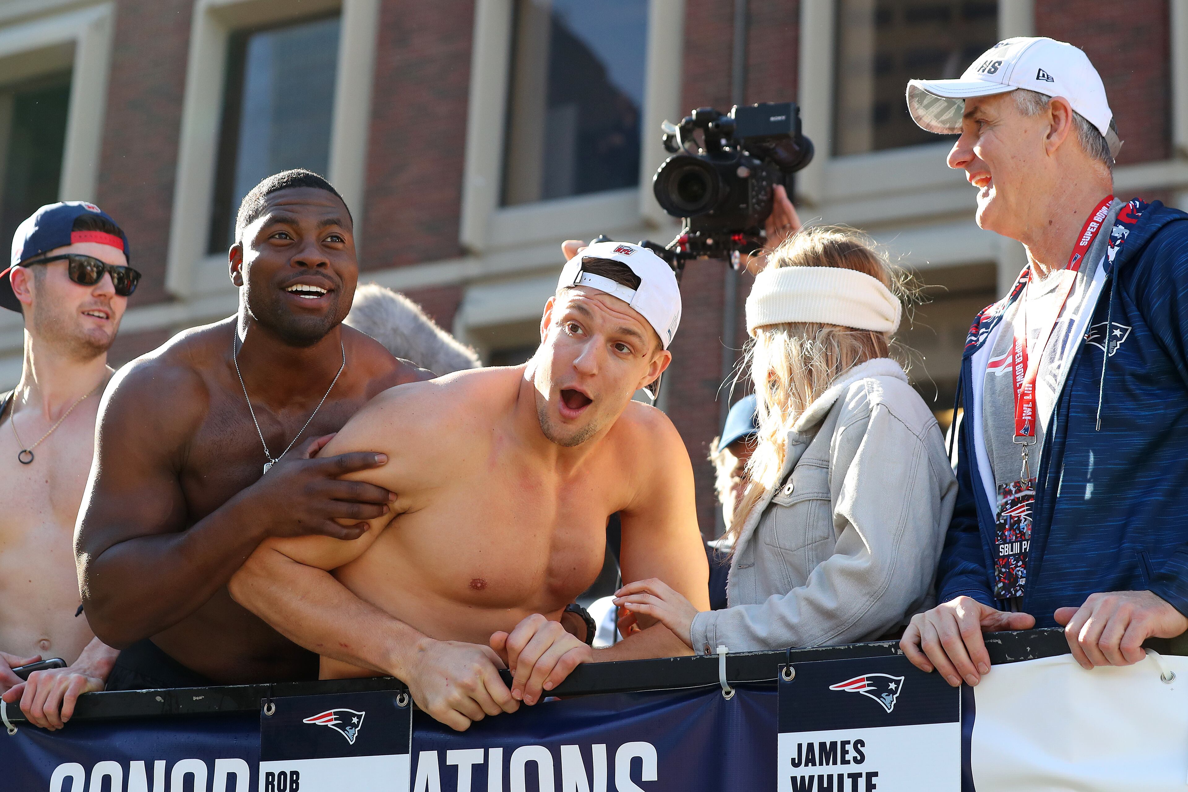 BOSTON, MASSACHUSETTS - FEBRUARY 05: Rob Gronkowski #87 of the New England Patriots, center, celebrates on Cambridge street during the New England Patriots Victory Parade on February 05, 2019 in Boston, Massachusetts. (Photo by Maddie Meyer/Getty Images)