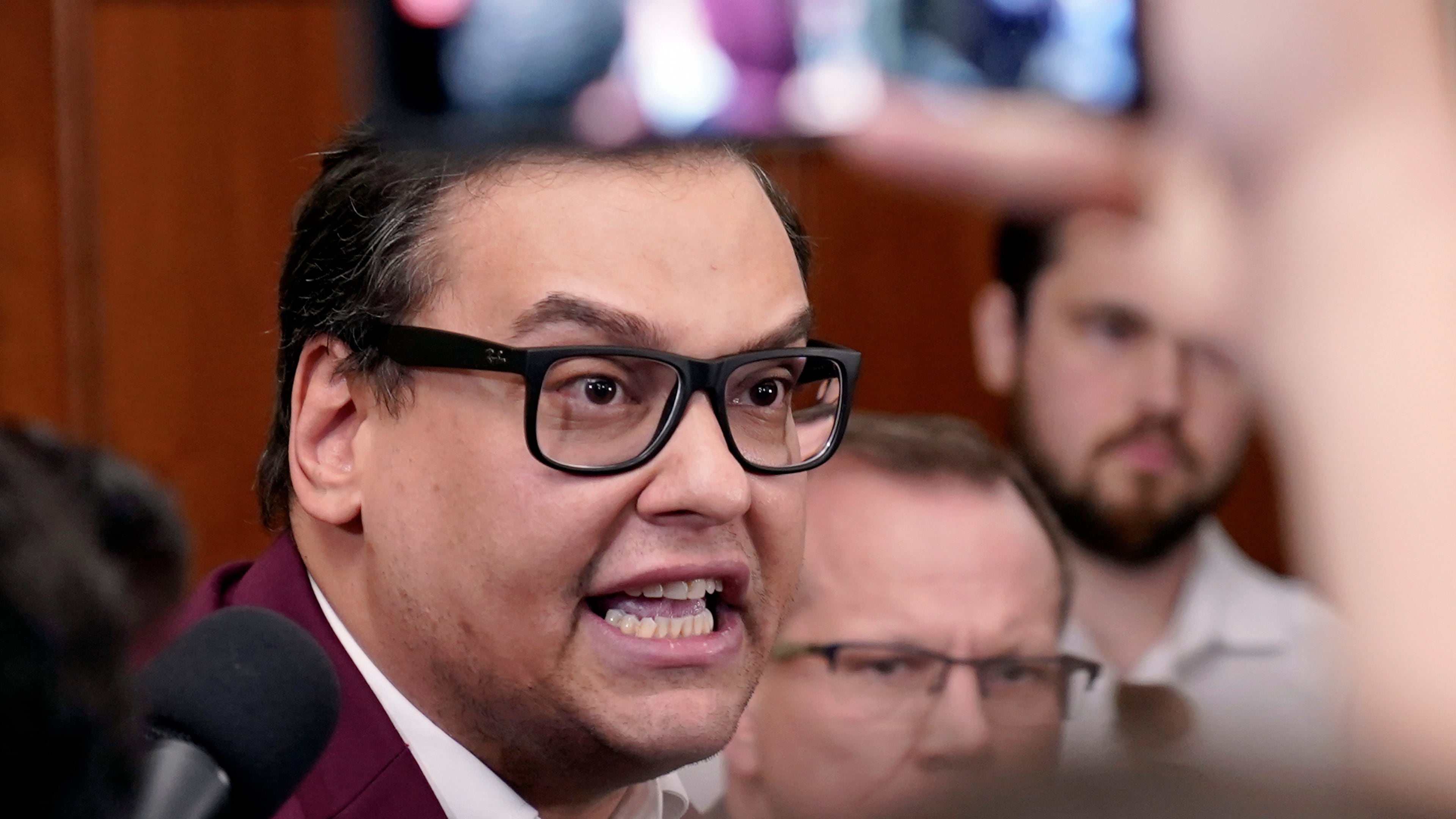 FILE - Rep. George Santos, R-N.Y., talks to reporters as House Republicans hold a caucus meeting at the Capitol in Washington, Oct. 13, 2023. (AP Photo/Mariam Zuhaib, File)