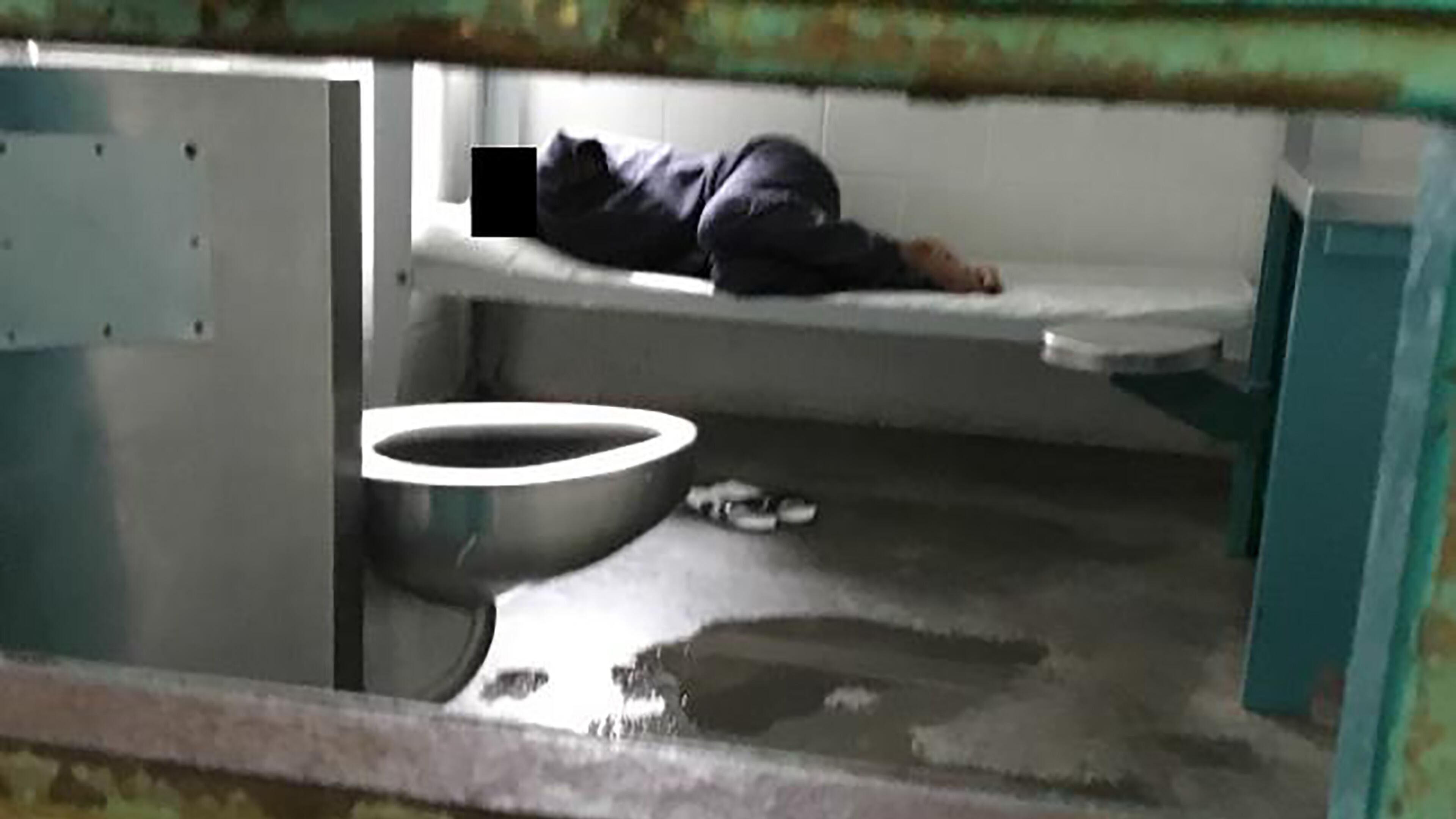 A woman lies on a thin mattress in her cell with water pooled at the foot of her metal bed, as seen during a midday visit at the South Fulton Municipal Regional Jail. This image is included in a federal lawsuit filed Wednesday, April 10, 2019, by the Georgia Advocacy Office and two women being held at the jail. The lawsuit includes graphic photos from a recent visit to the jail — among them this one — and details unimaginable conditions for the women detainees.