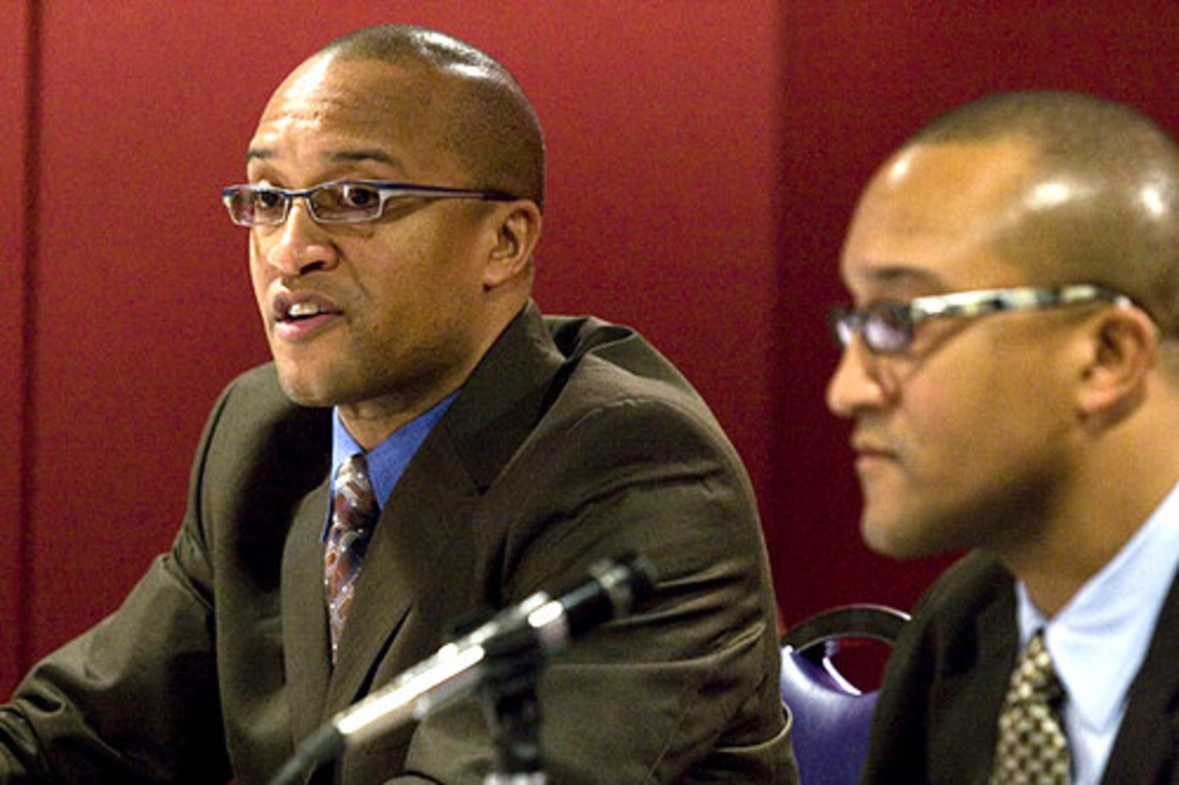 Don't blink twice. Yes, it's twin doctors Vance (left) and Vincent Moss as they speak to the press. Vincent is a cardiothoracic surgeon, and Vance is a urologist. The twins were honored for their work in Afghanistan.