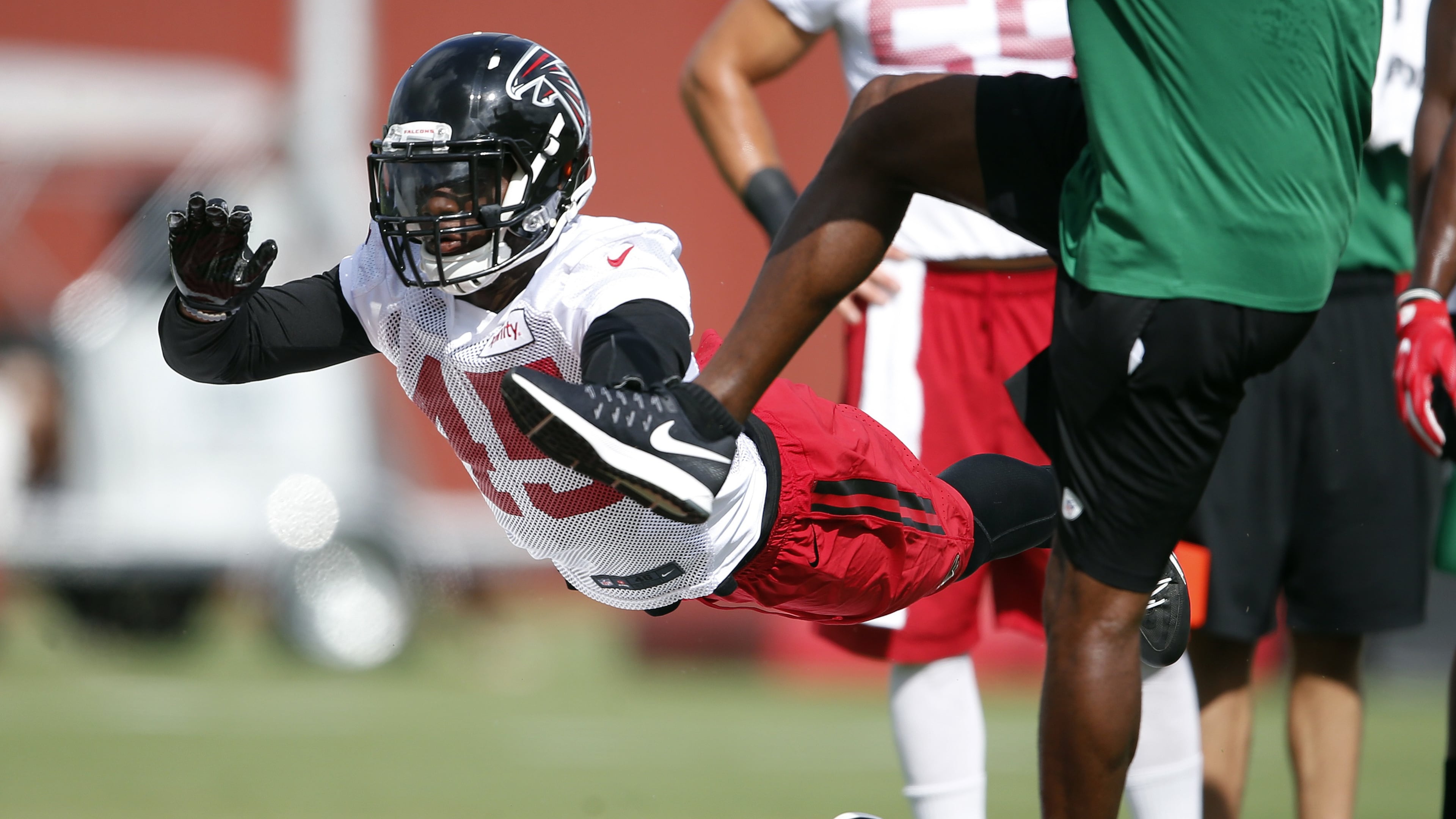 Atlanta Falcons outside linebacker Deion Jones (45) works on his kick blocking skills during an NFL football practice Friday, July 29, 2016, in Flowery Branch, Ga. (AP Photo/John Bazemore)