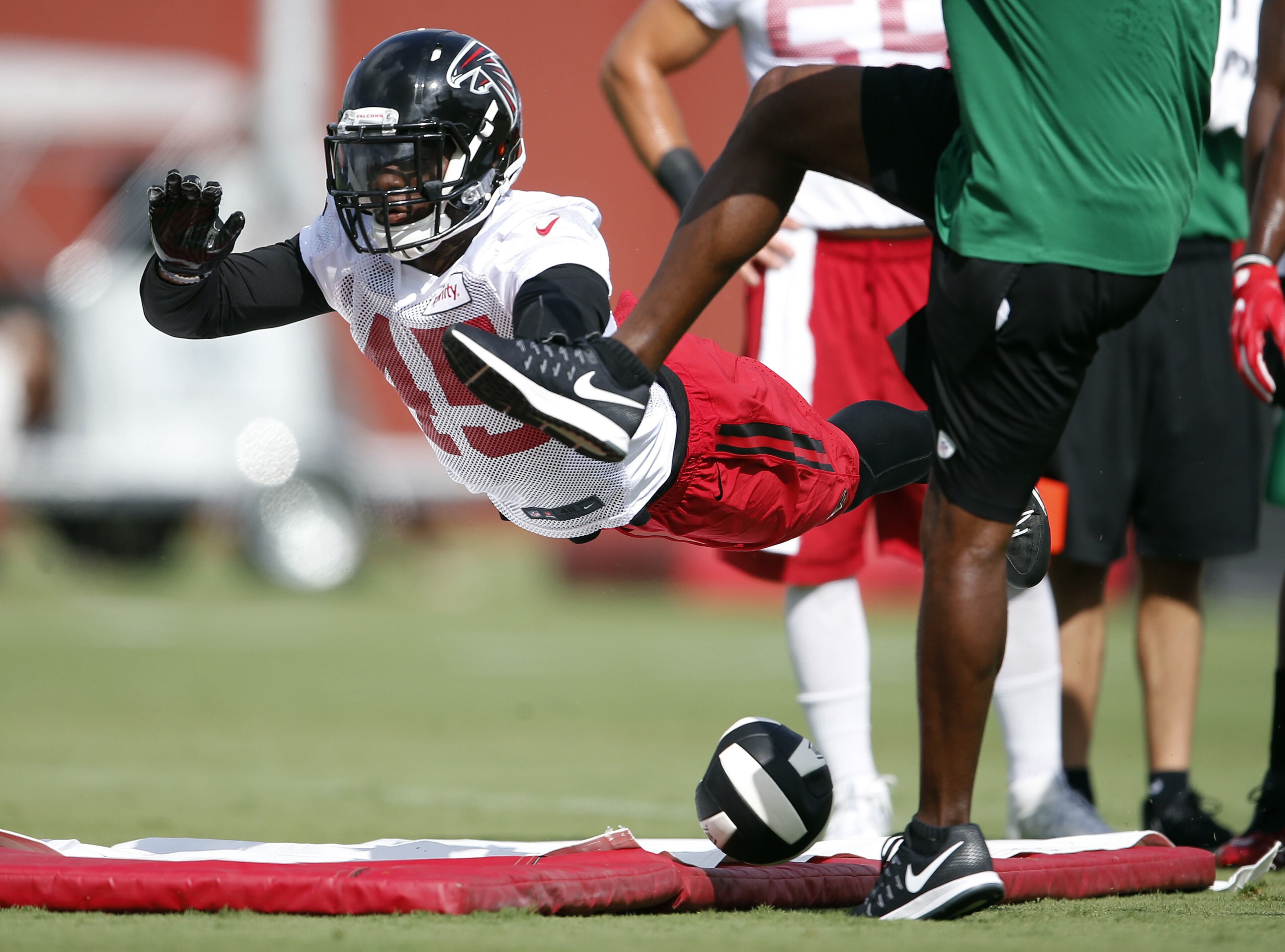 Atlanta Falcons outside linebacker Deion Jones (45) works on his kick blocking skills during an NFL football practice Friday, July 29, 2016, in Flowery Branch, Ga. (AP Photo/John Bazemore)