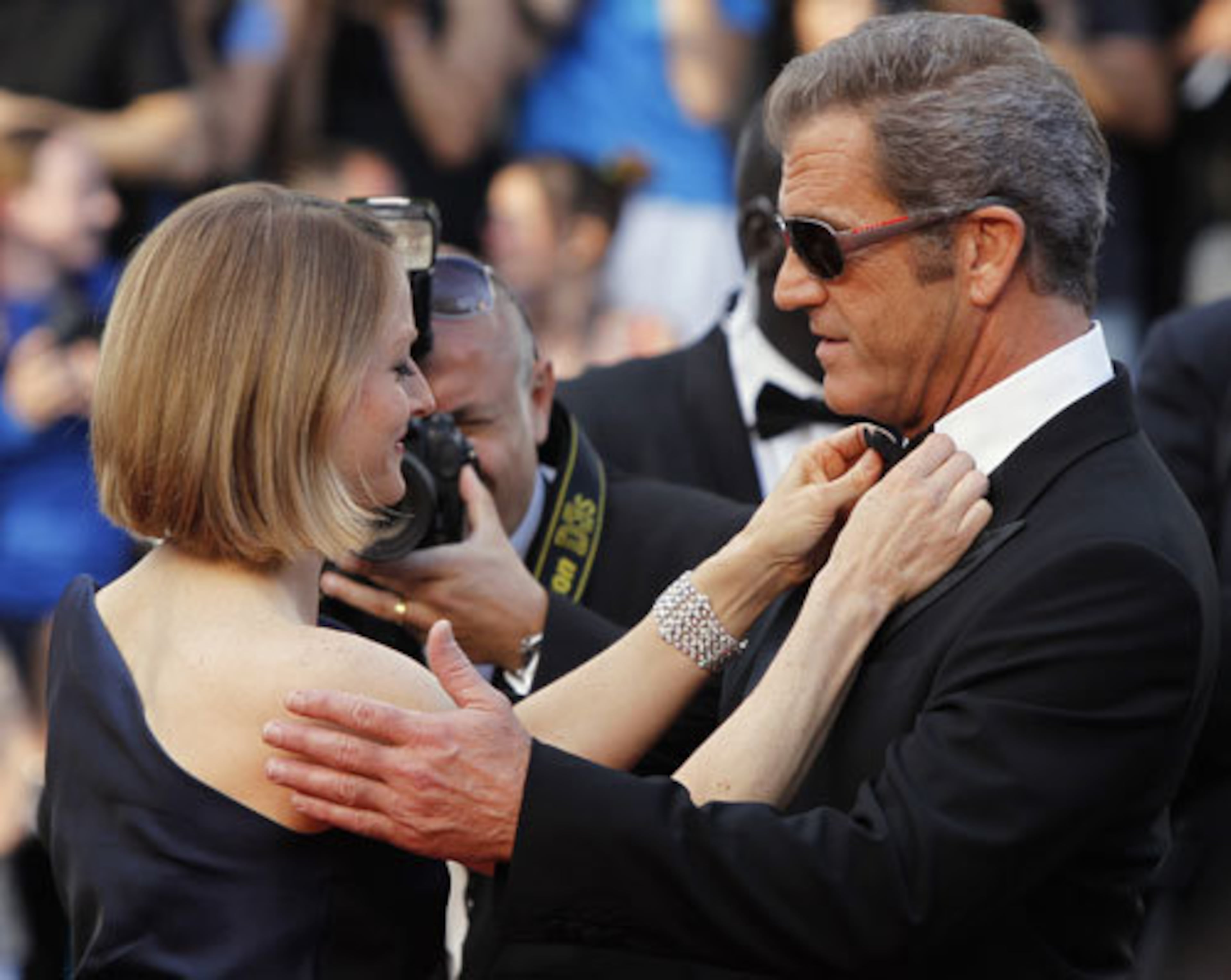 In a tender moment Jodie Foster adjusts the tie of Mel Gibson as they arrive for a screening of "The Beaver" at the 64th international film festival, in Cannes, southern France, Tuesday, May 17, 2011. Up until the special screening at Cannes Gibson had stayed out of the public eye, not attending any public appearances for the film.