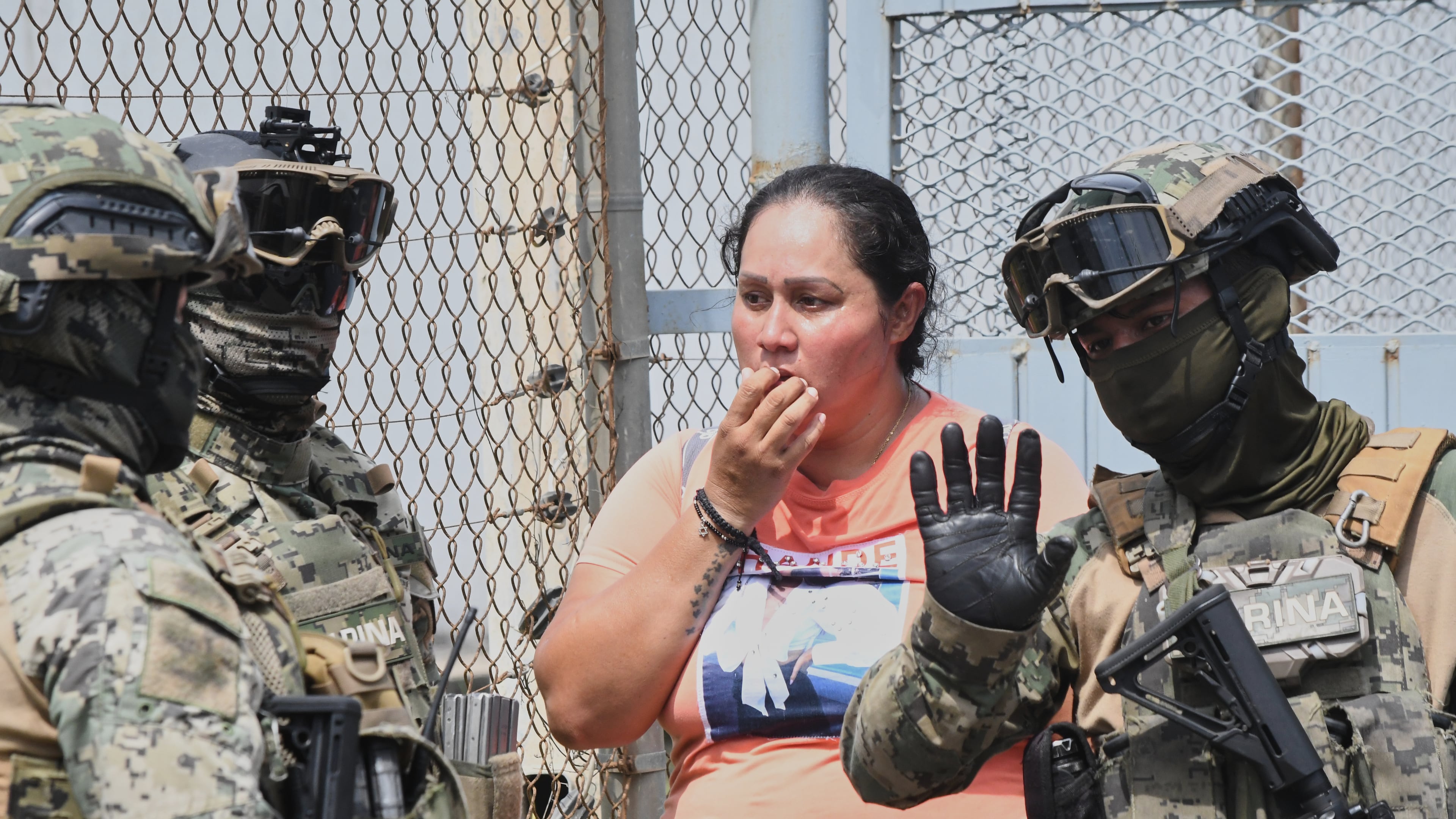 A relative of an inmate speaks with some Mexican Navy officers during a riot at the El Castillo Penitentiary in Mazatlan, Mexico, Thursday, Oct. 8, 2026. (AP Photo/Fausto Camacho)