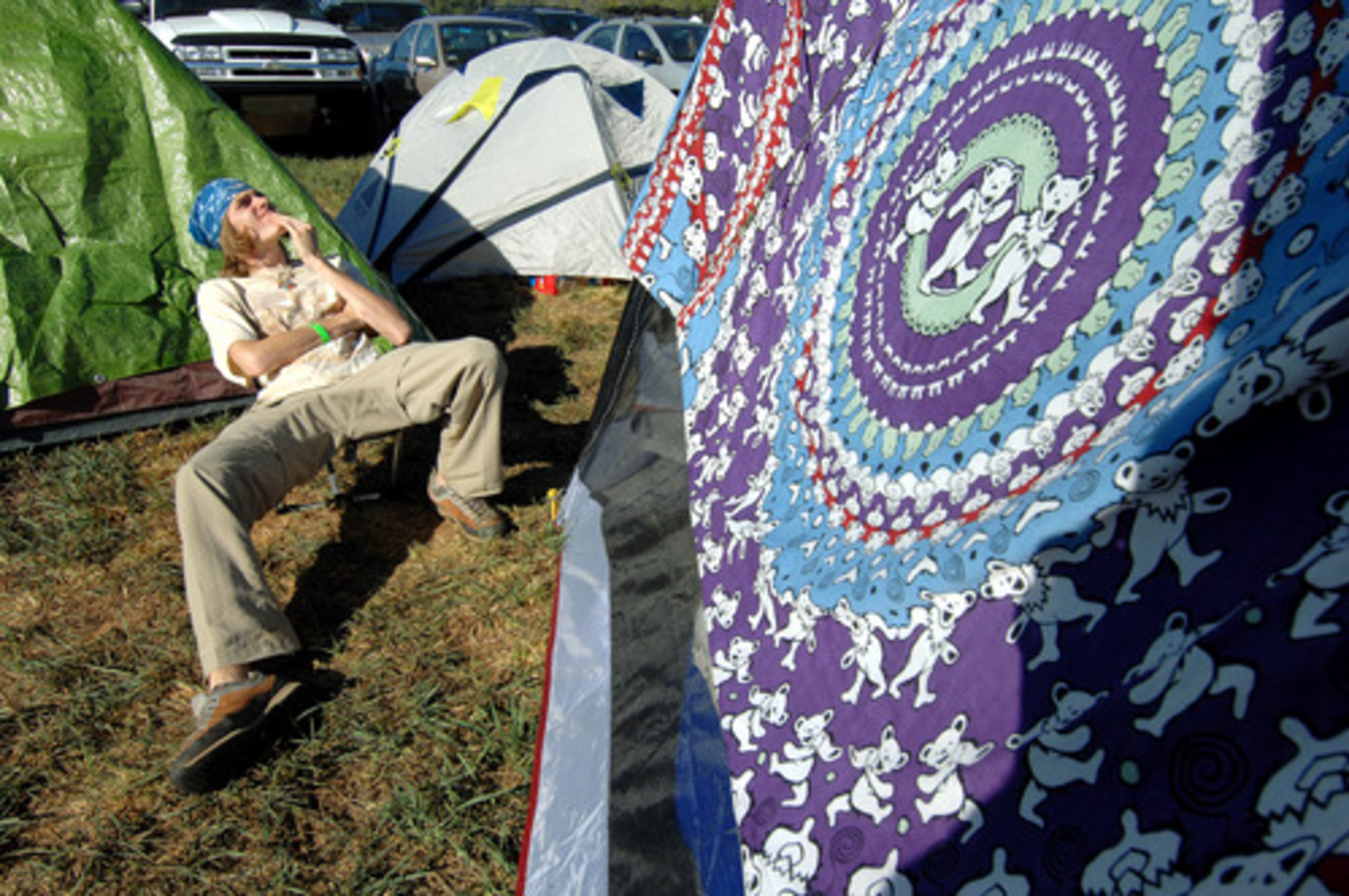 Mark Berger of Hendersonville, N.C., enjoys the sun in the camping area Thursday morning. He is a huge Grateful Dead fan and looks forward to hearing former Grateful Dead member Phil Lesh on Sunday.