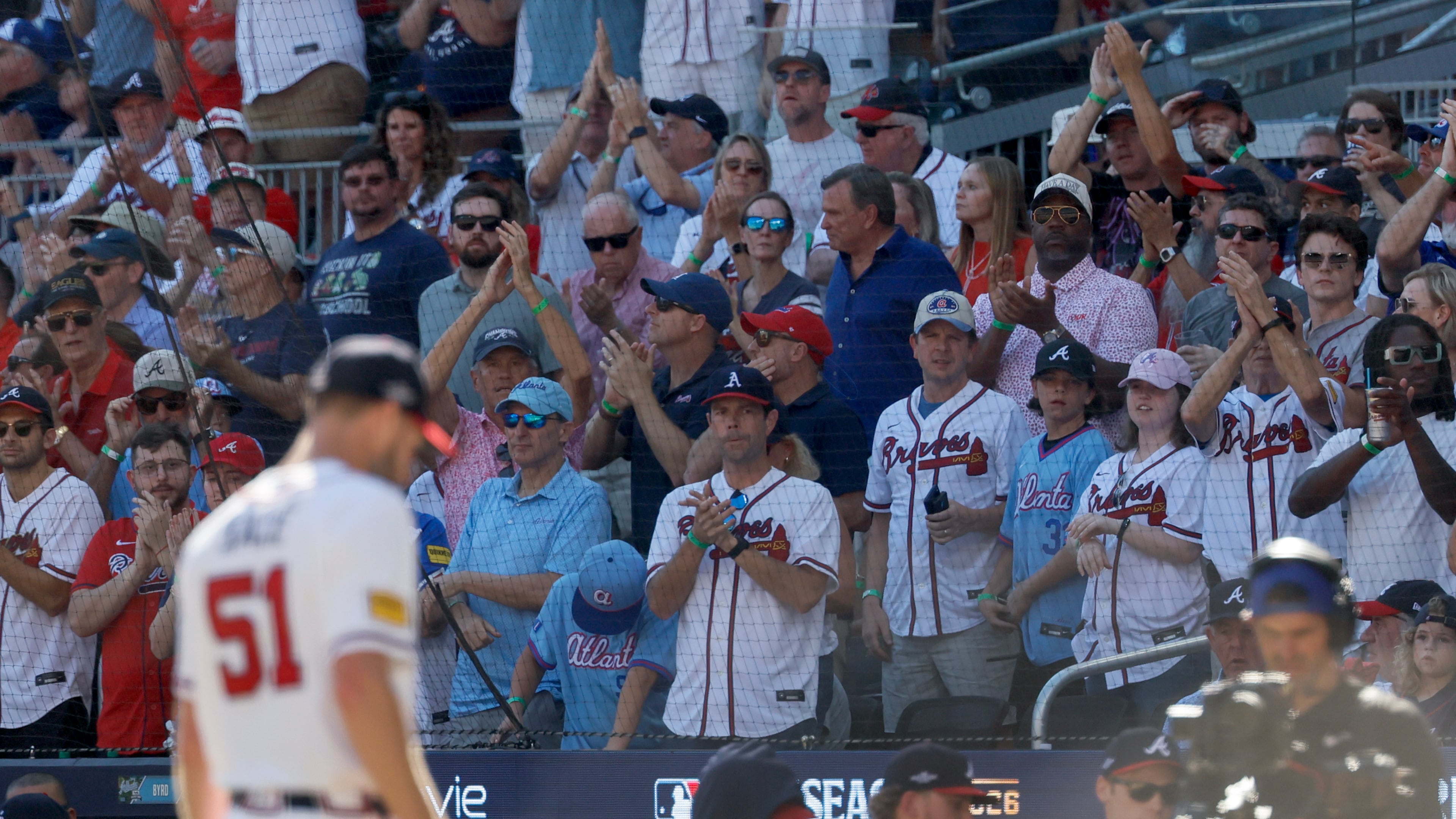 Fans cheer for Braves pitcher Chris Sale as he leaves the field during Game 1 of their NL Wild Card Series against the Philadelphia Phillies on Tuesday, Sept. 29, 2026, in Atlanta. (Miguel Martinez/AJC)
