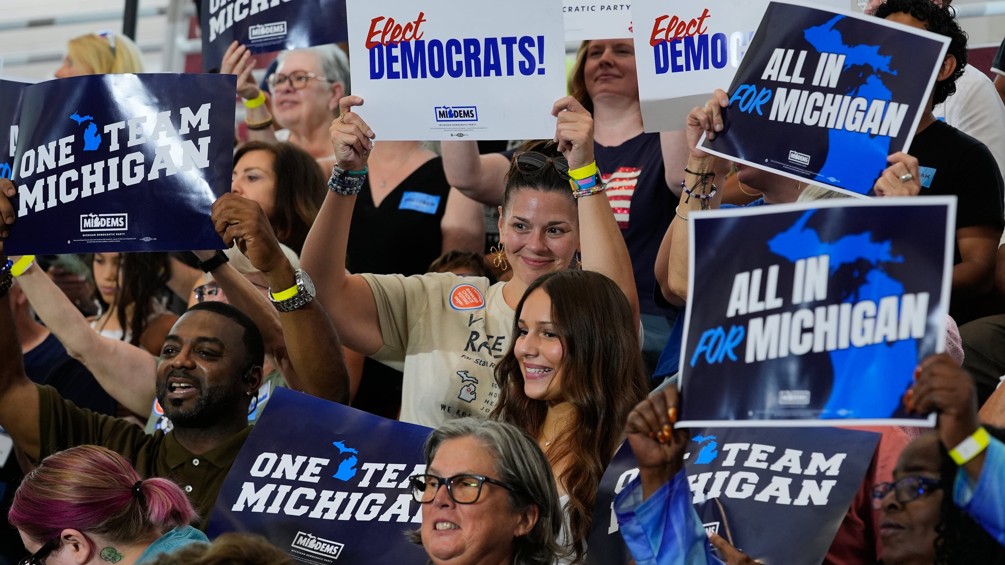 Supporters cheer at a Democratic General Election Kickoff Rally at Renaissance High School Friday, Aug. 7, 2026, in Detroit. (AP Photo/Paul Sancya)