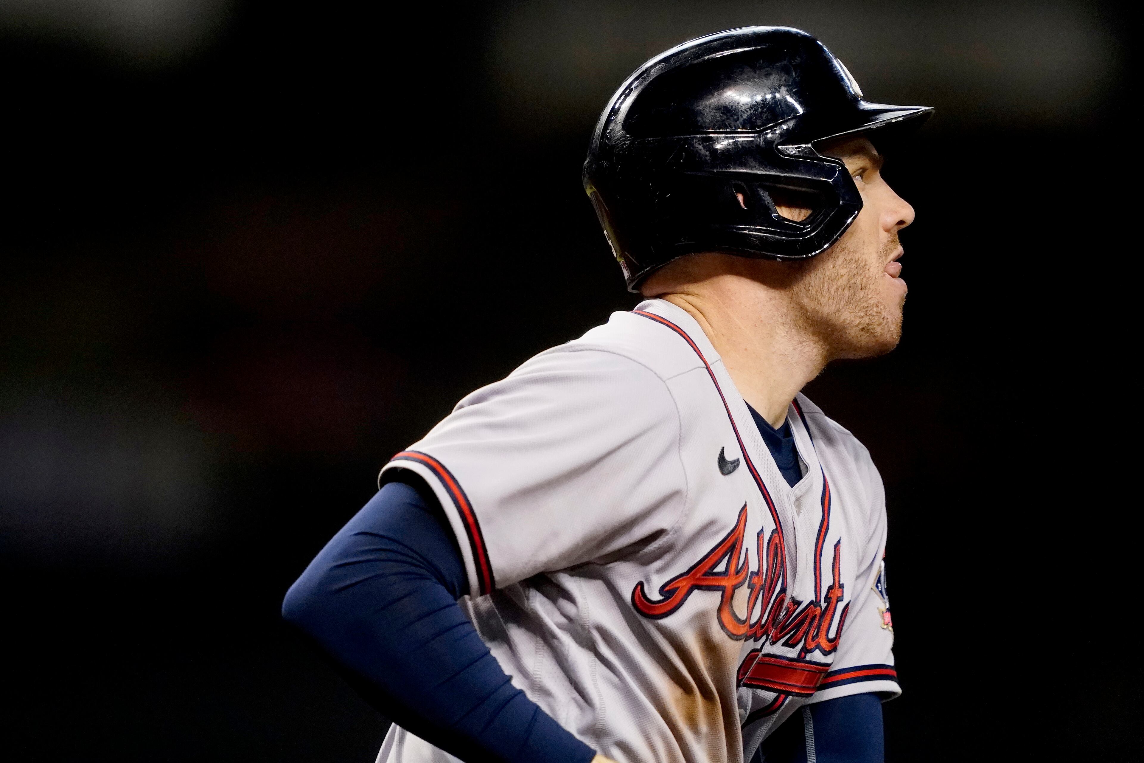 Atlanta Braves' Freddie Freeman watches his base hit drop during the fifth inning of a baseball game against the Arizona Diamondbacks, Tuesday, Sept. 21, 2021, in Phoenix. (AP Photo/Matt York)