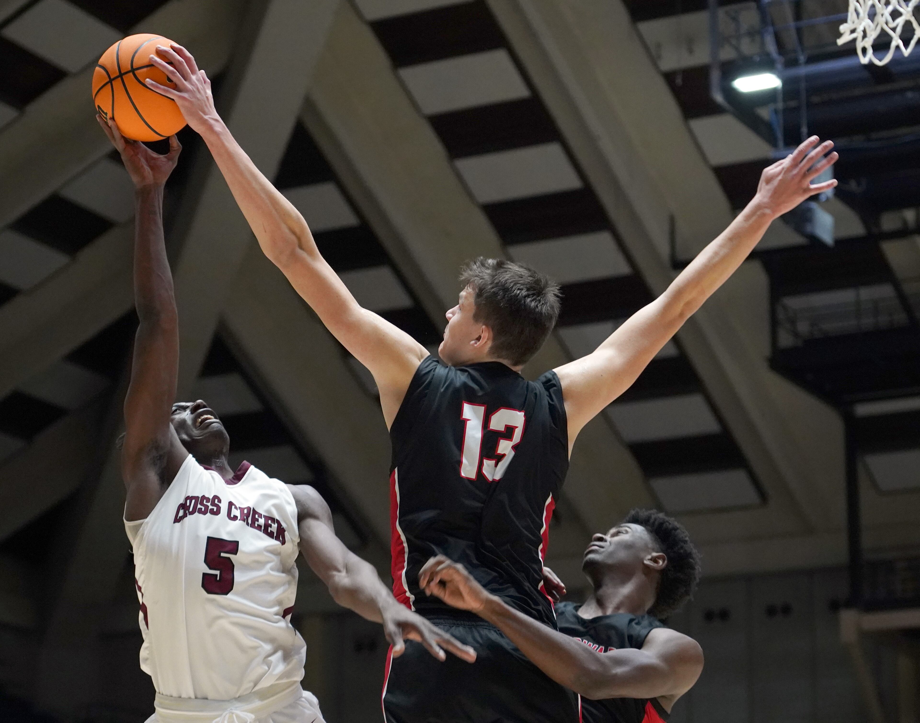 Woodward Academy's Walker Kessler (13) blocks a shot from Cross Creek's Amakhi Climons (5) in the first half of the Class AAAA boys title basketball game at the Macon Centreplex, Friday March 6, 2020, in Macon. Tami Chappell for the Atlanta Journal Constitution
