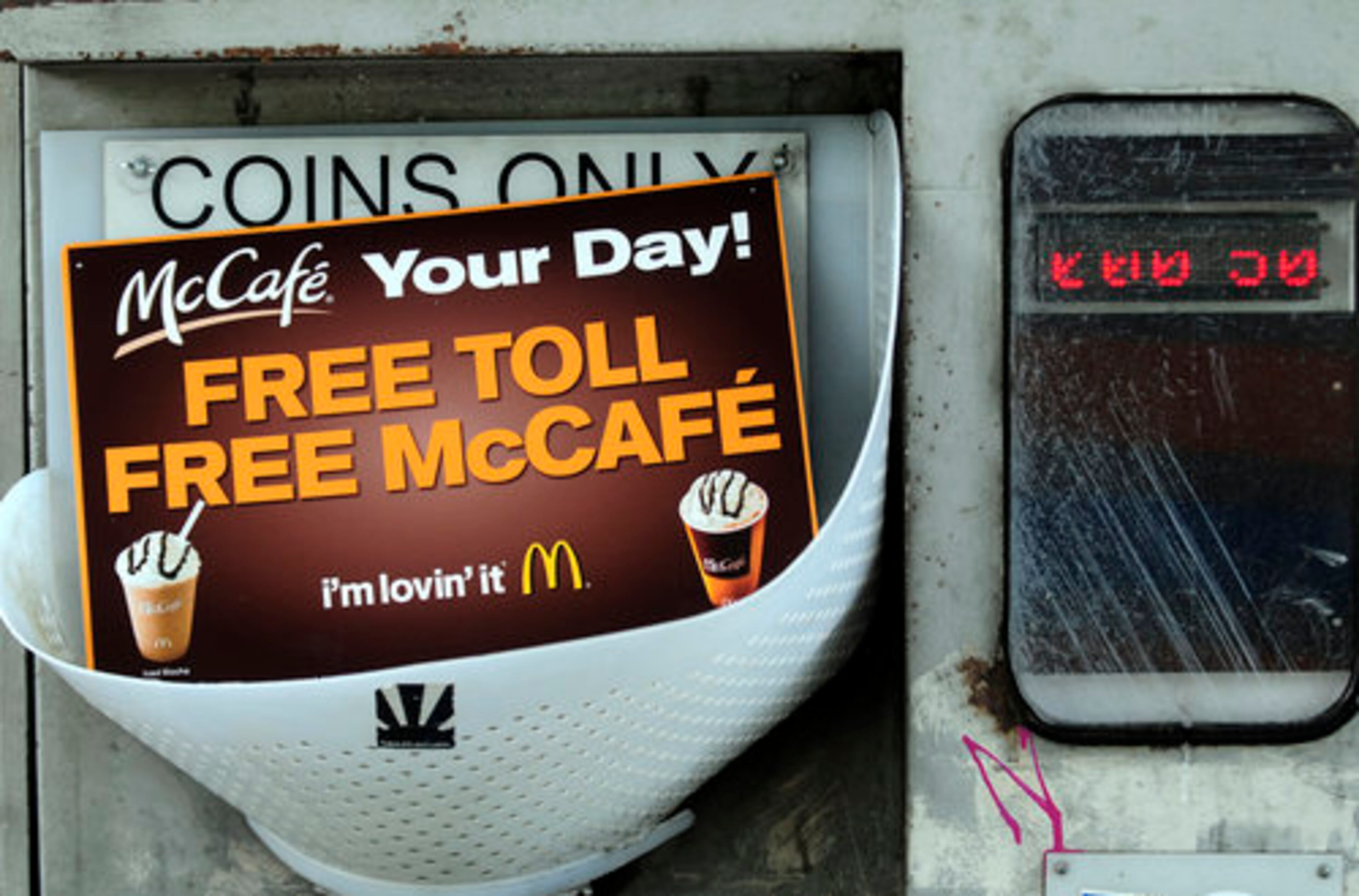 McDonald's marketing push for a new McCafe drink paid the way for drivers going through the Ga 400 toll booths in Atlanta Wednesday. Toll workers gave out 7000 McCafe coupons to drivers, offering them a free hot or medium iced McCafe coffee and paid their 50-cent toll. The coupon expires June 30, 2009.