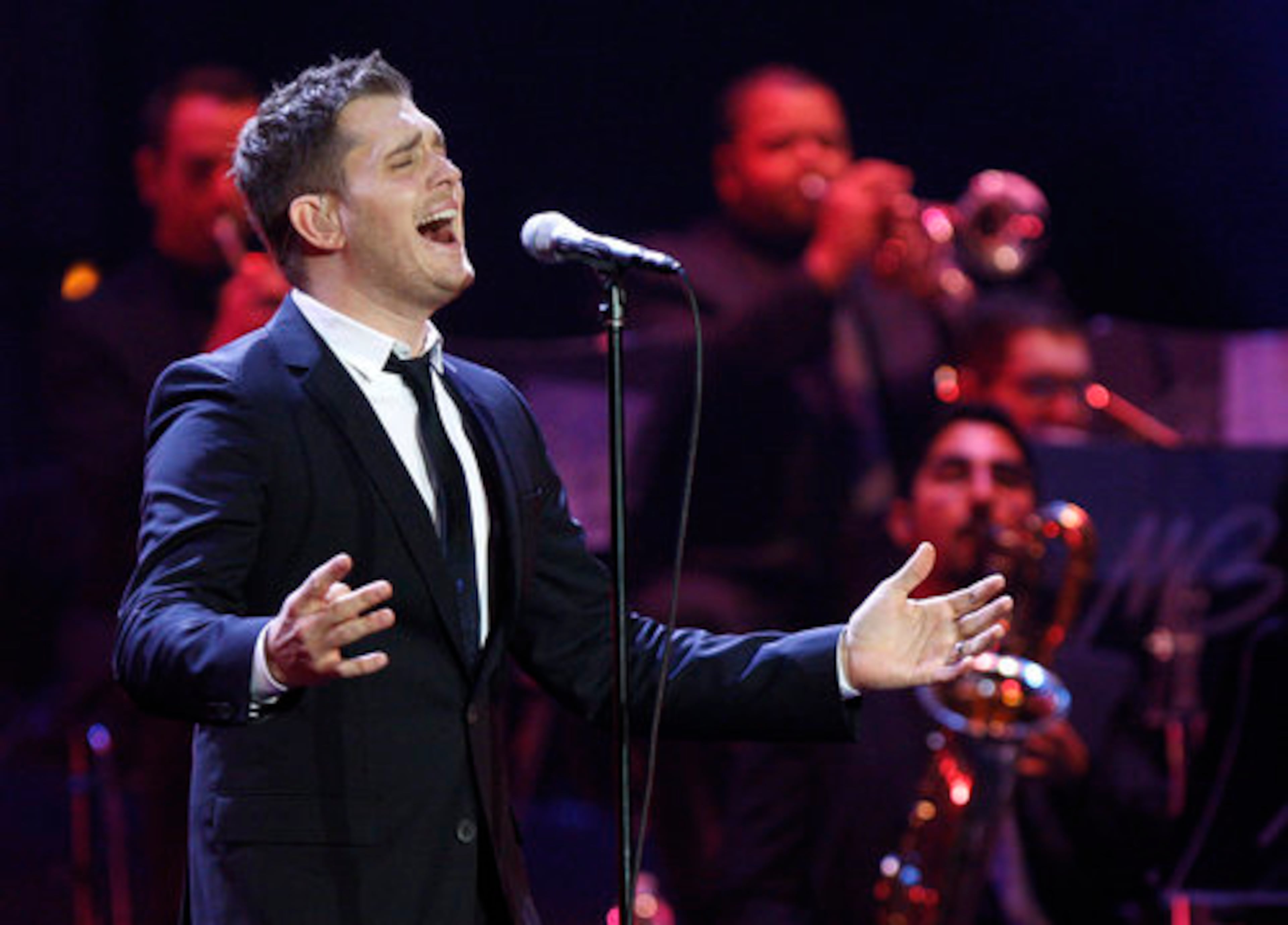 Michael Bubl thrilled fans when his Crazy Love tour made a stop at Gwinnett Arena. The Canadian singer's brass section backs him up.