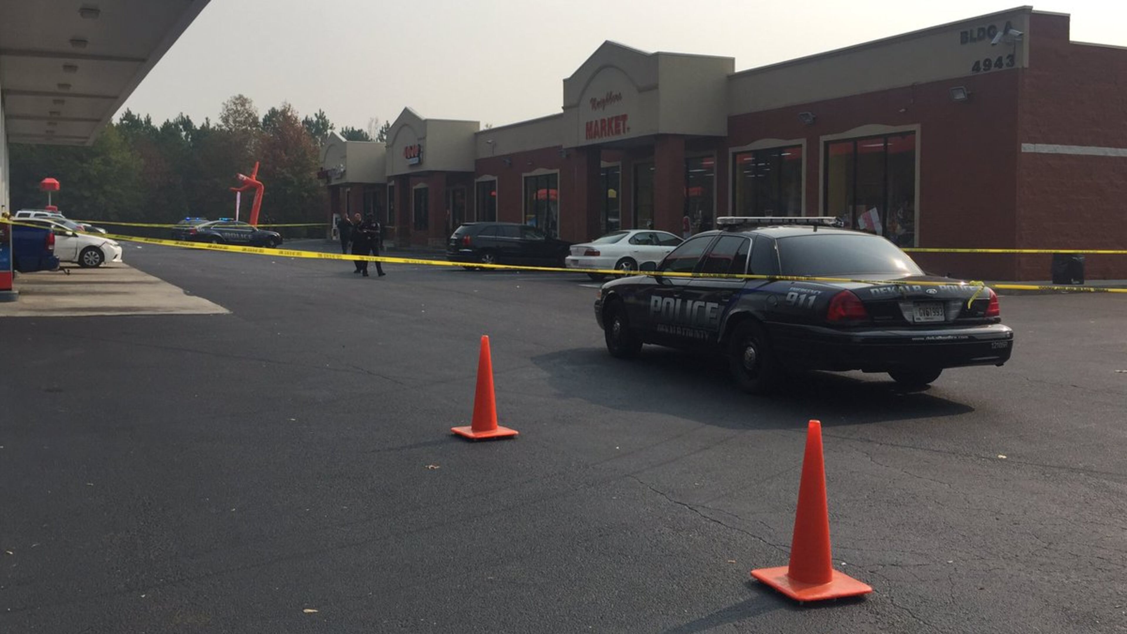 Two people were shot outside a cellphone store in DeKalb County on Monday. (Credit: Channel 2 Action News)