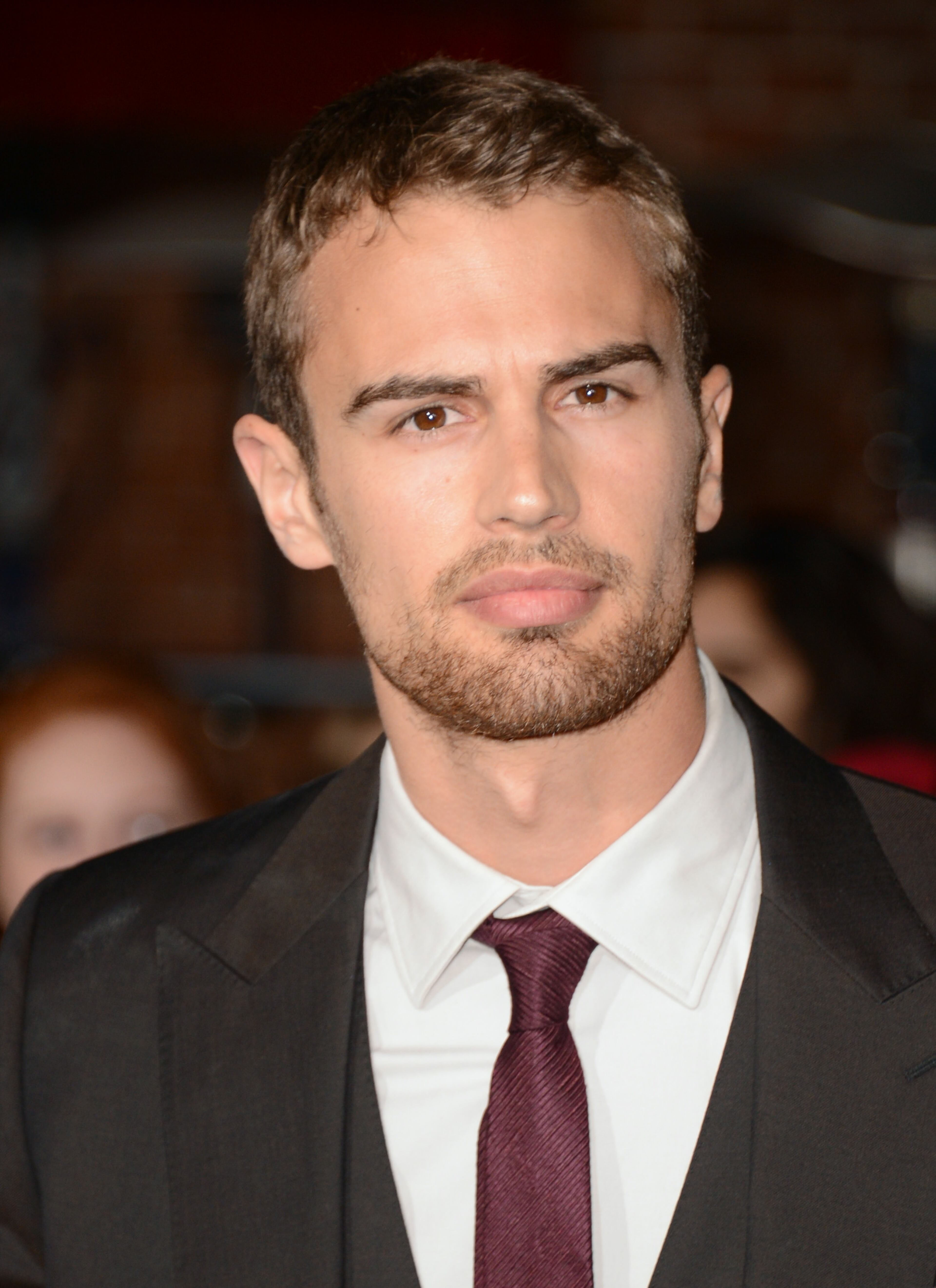 Theo James arrives at the world premiere of "Divergent" at the Westwood Regency Village Theater on Tuesday, March 18, 2014, in Los Angeles. (Photo by Jordan Strauss/Invision/AP)