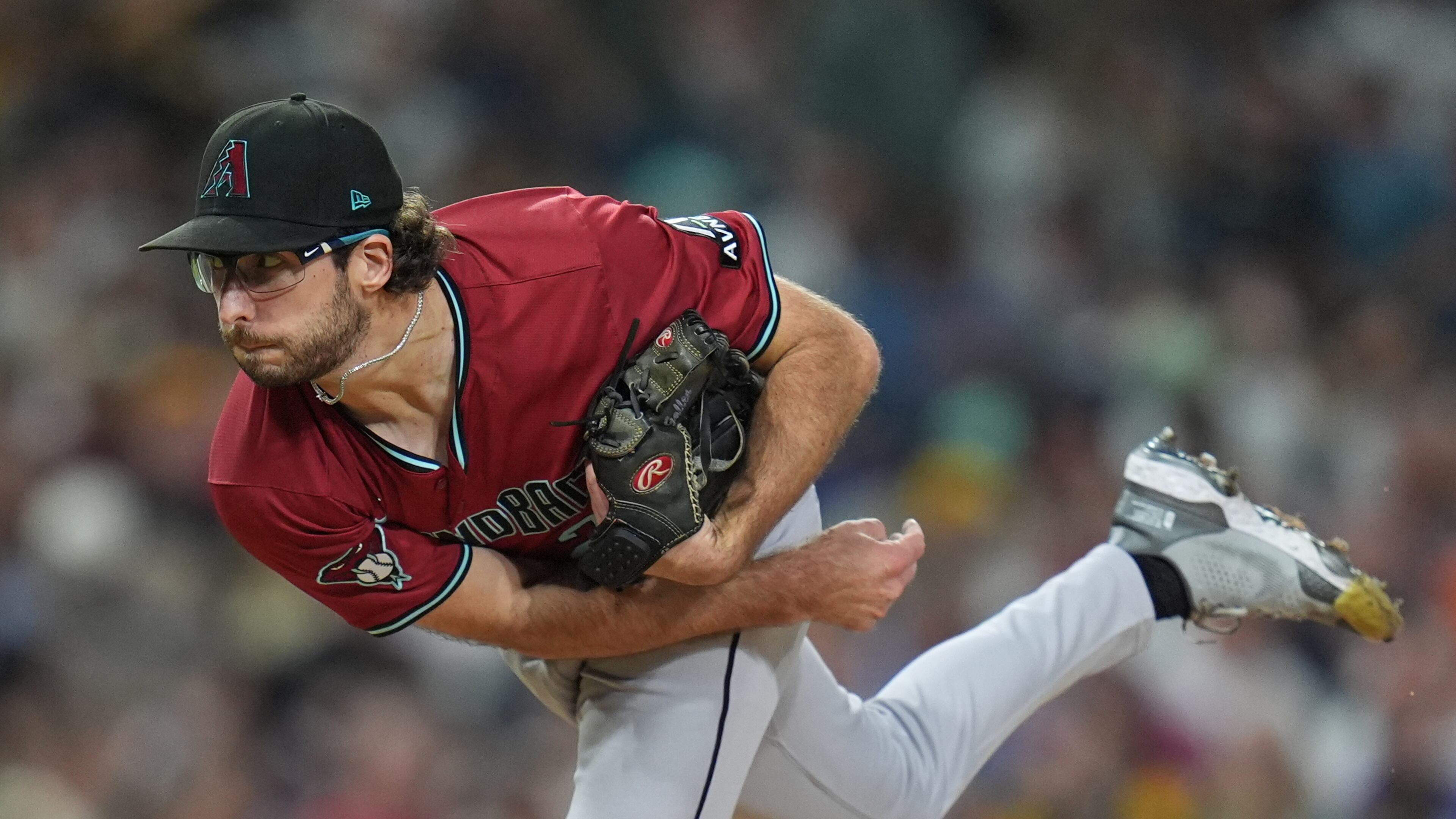 FILE - Arizona Diamondbacks starting pitcher Zac Gallen works against a San Diego Padres batter during the third inning of a baseball game Friday, Sept. 26, 2025, in San Diego. (AP Photo/Gregory Bull,File)