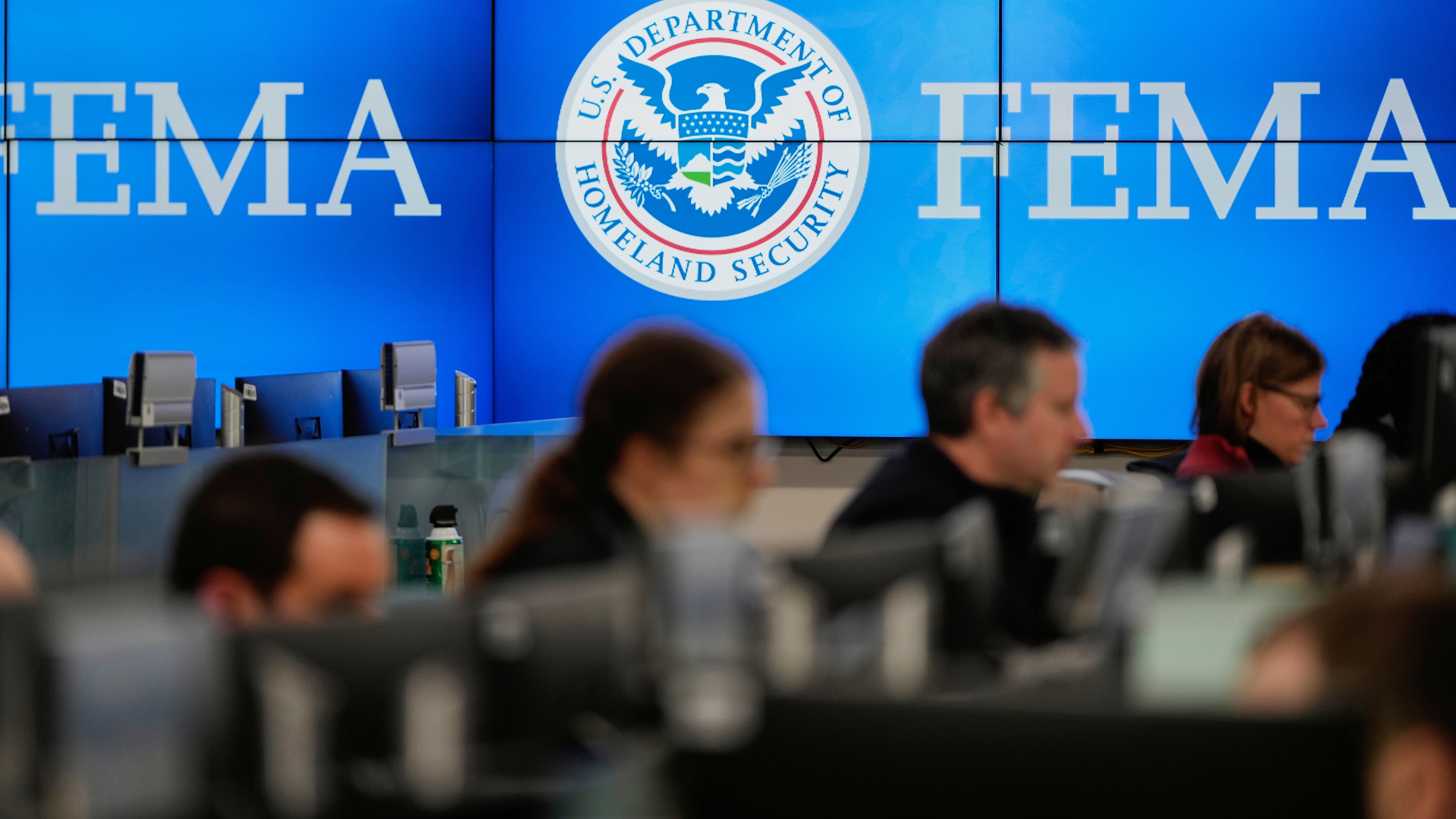 FILE - People work at the Federal Emergency Management Agency headquarters in Washington, on Saturday, Jan. 24, 2026. (AP Photo/Julia Demaree Nikhinson, File)