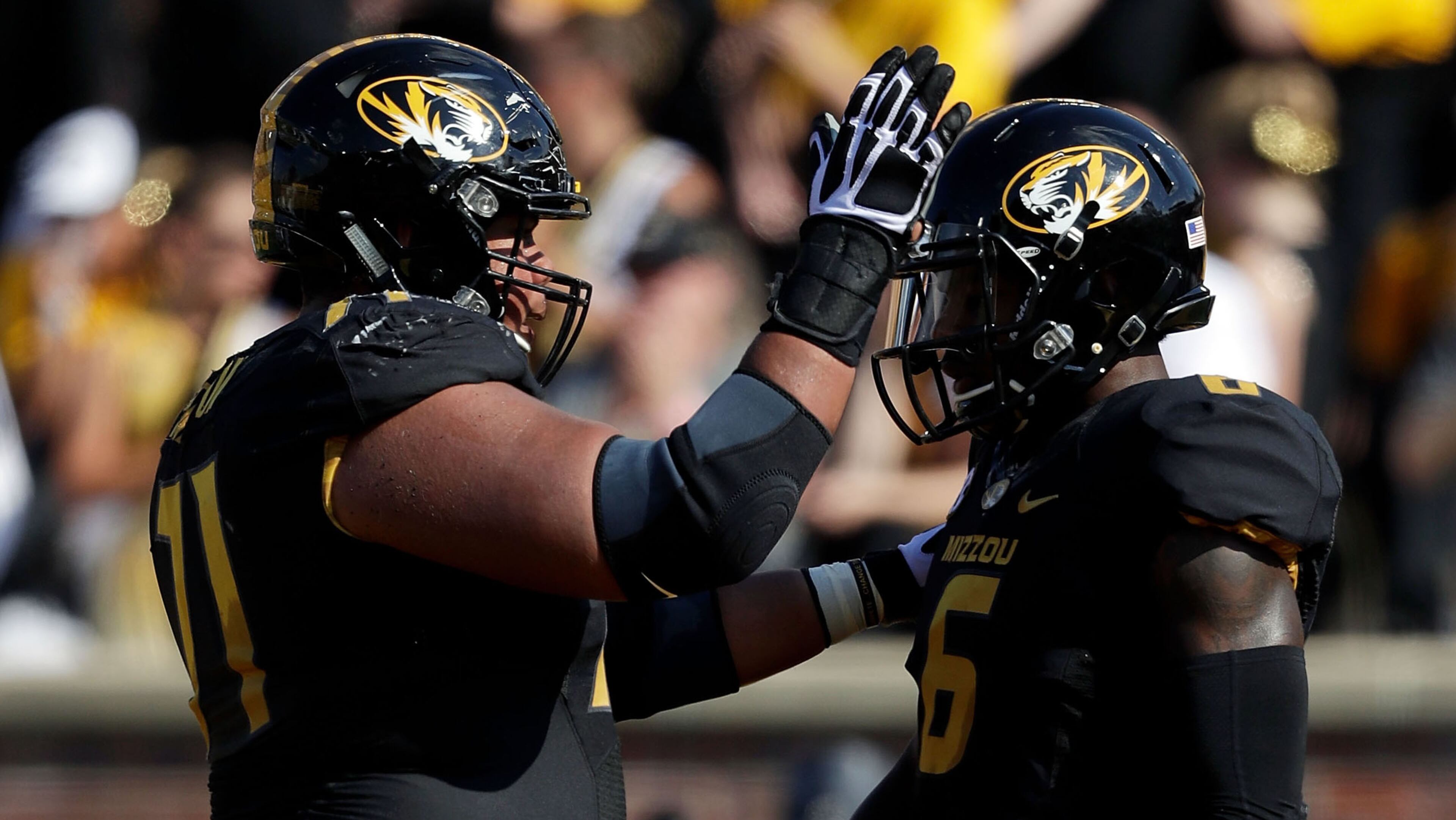 COLUMBIA, MO - SEPTEMBER 24: Wide receiver J'Mon Moore #6 of the Missouri Tigers is congratulated by offensive lineman Kevin Pendleton #71 of the Missouri Tigers after scoring a touchdown during the game at Faurot Field/Memorial Stadium on September 24, 2016 in Columbia, Missouri. (Photo by Jamie Squire/Getty Images)