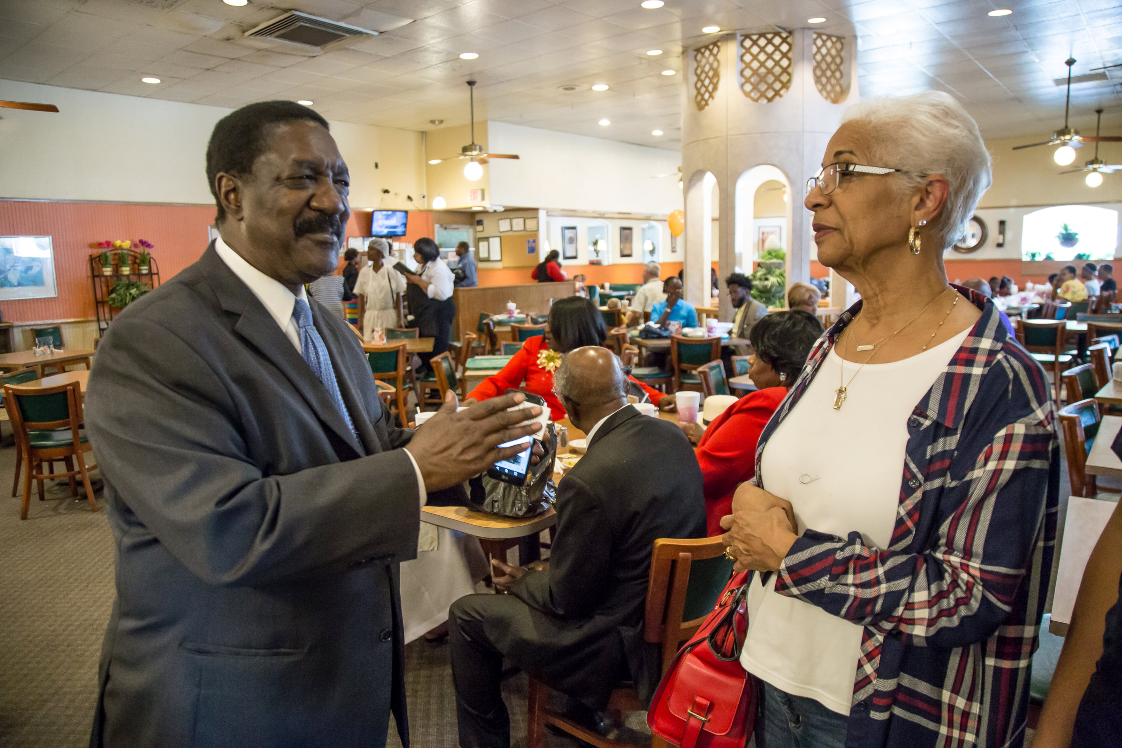 Ira Joe Johnson (left) talks with Bunnie Jackson-Ransom on ways they might be able to keep S&S Cafeteria open on the restaurant's last day, Sept. 30, 2018. Johnson said he ate at the S&S Cafeteria with Maynard Jackson, Martin Luther King and other civil rights dignitaries over the years.