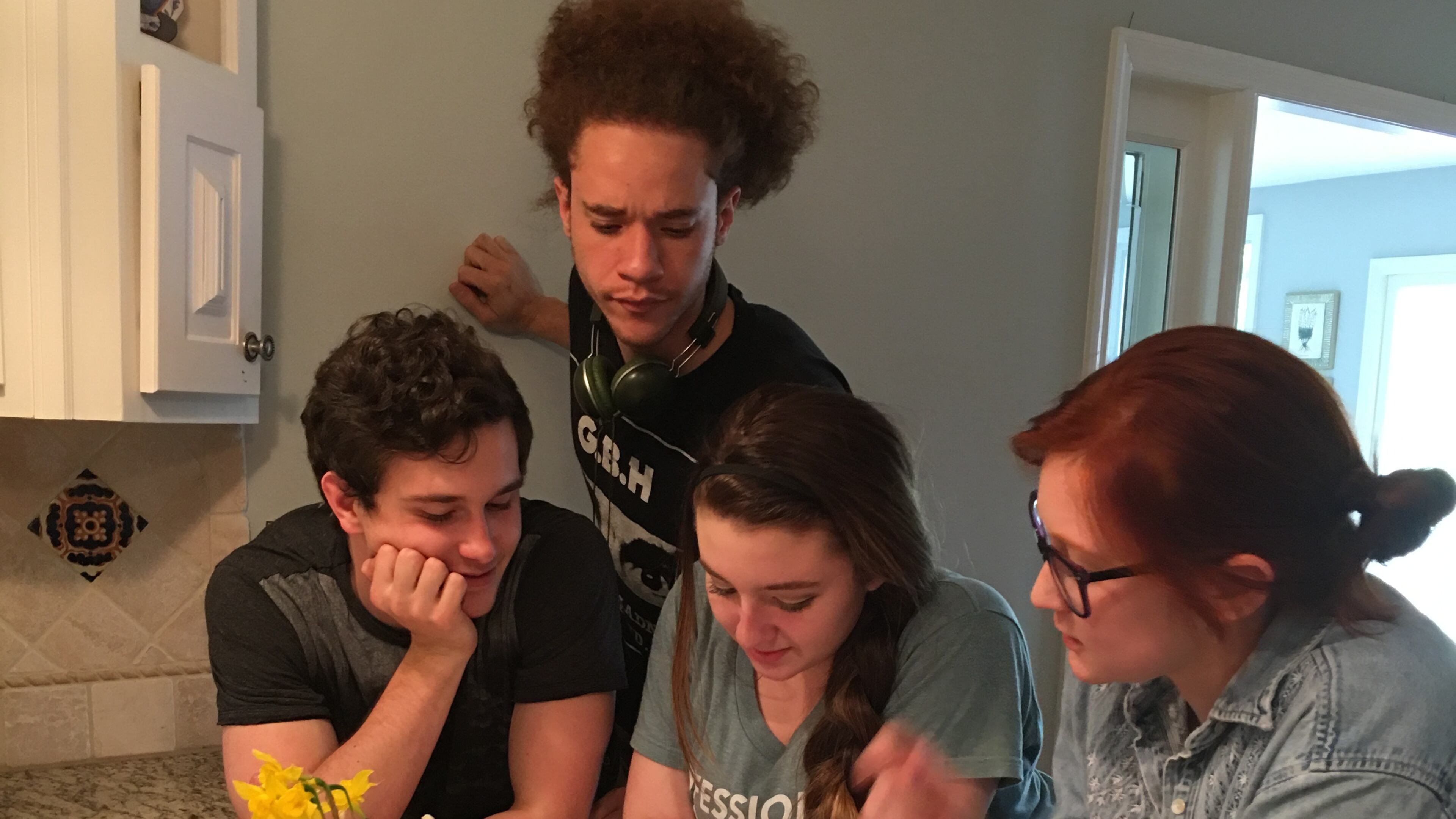 Kathryn-Grace Stacio (seated in the center) goes over script changes to her movie “A Memory Jar” with photography director John Roche (left), assistant director Ashyln Stallings (right), and sound director Matty Forde (standing). CONTRIBUTED