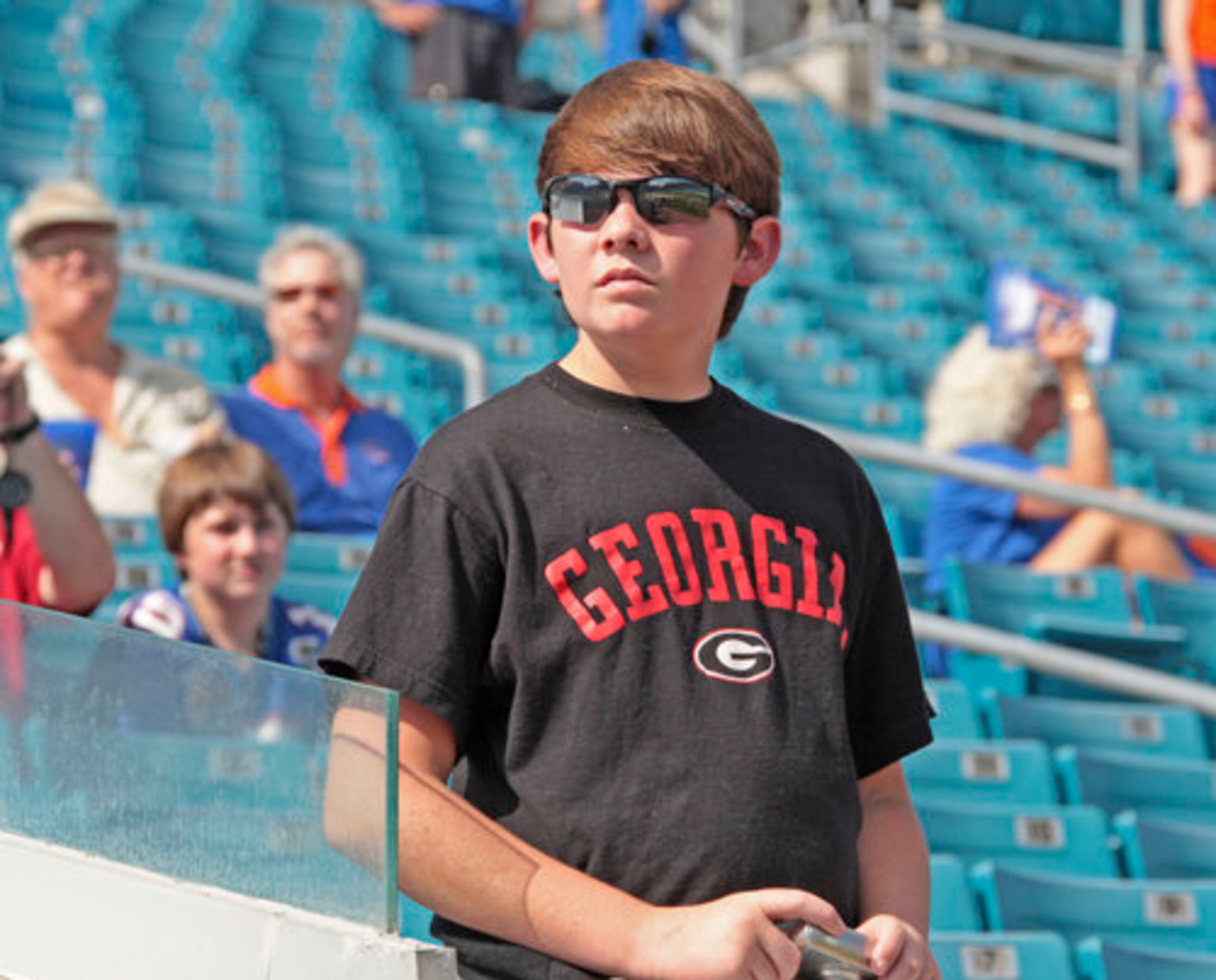 Tyler Edgin, from Lugoff, S.C., is one of the first fans in Jacksonville Municipal Stadium on Saturday prior to the start of the Georgia-Florida game.