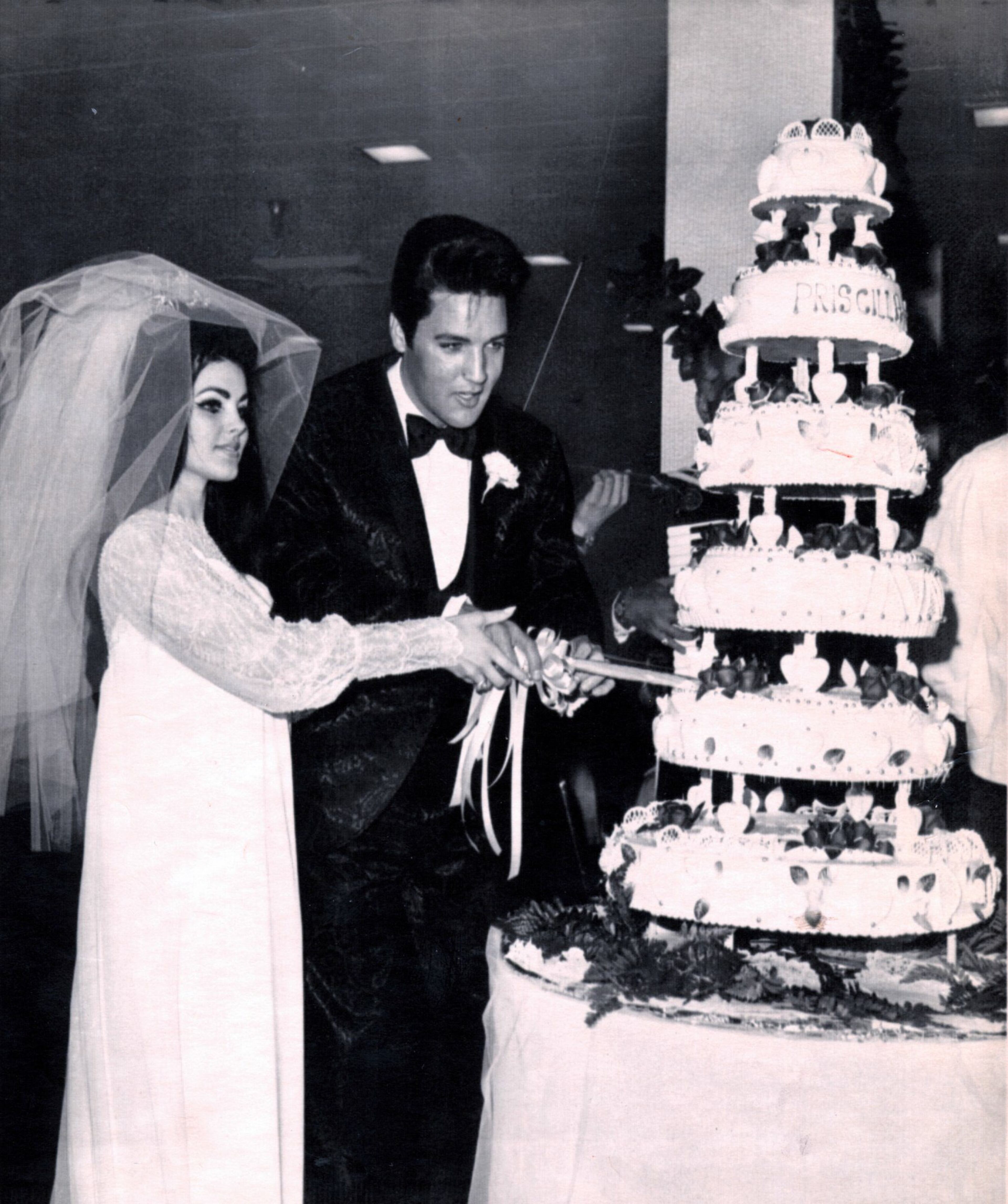 Elvis Presley and his new bride Priscilla cut the cake at their wedding reception in Las Vegas in May 1967.