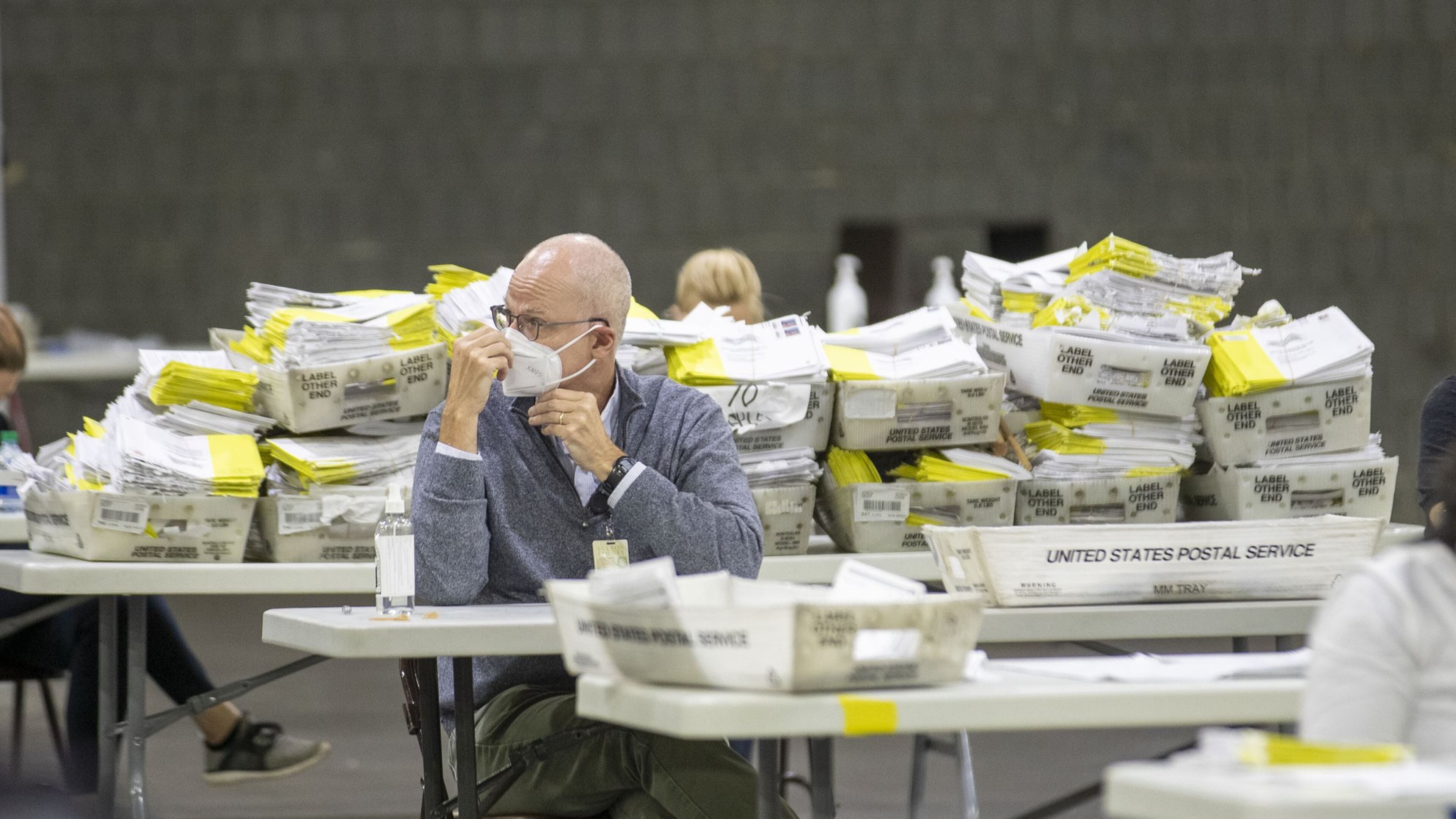 Mail-in paper ballots wait to be scanned by Fulton County employees at the Georgia World Congress Center during last week’s Georgia primary elections. (ALYSSA POINTER / ALYSSA.POINTER@AJC.COM)