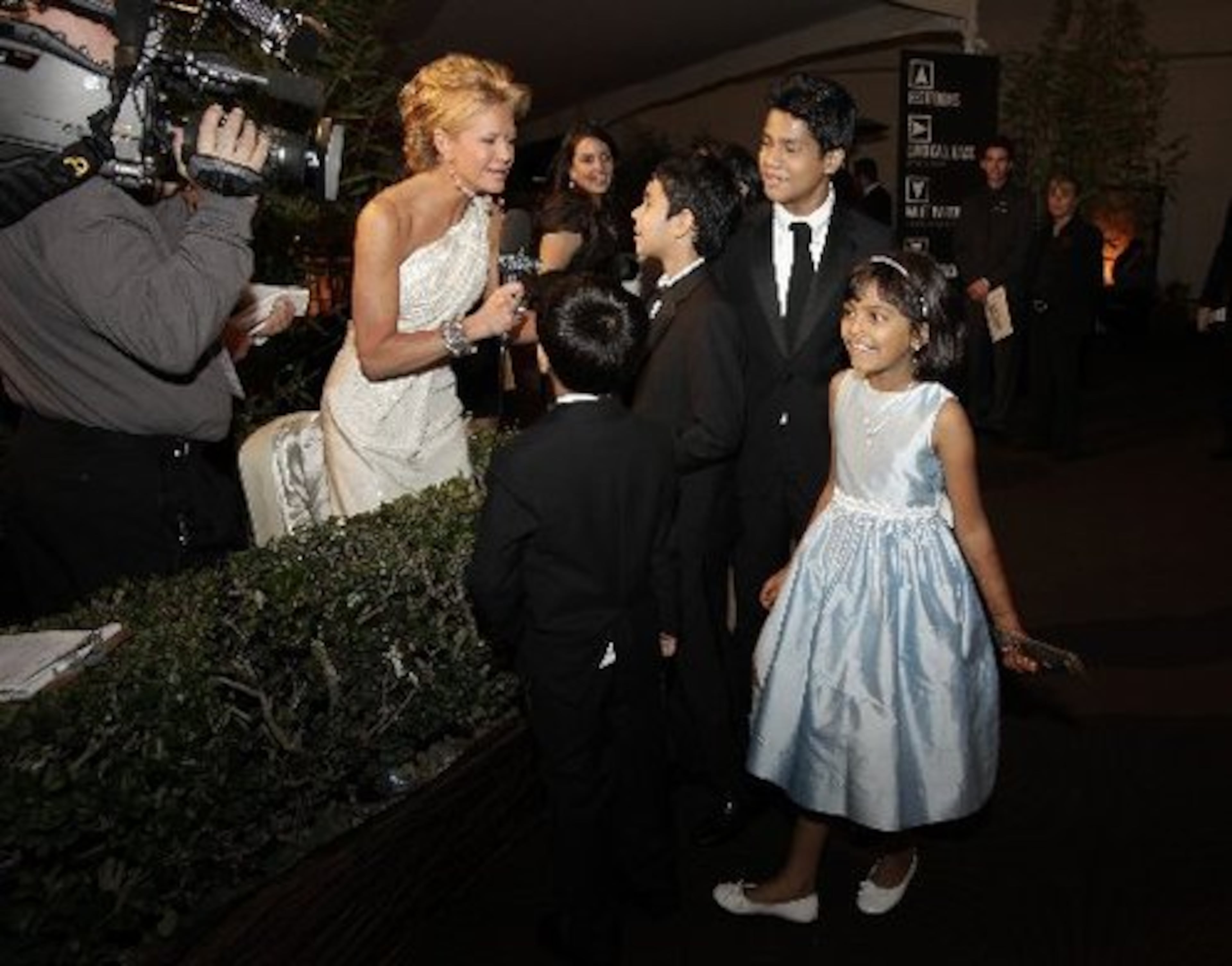 Cast members were interviewed as they arrived at a ball following the Oscars.