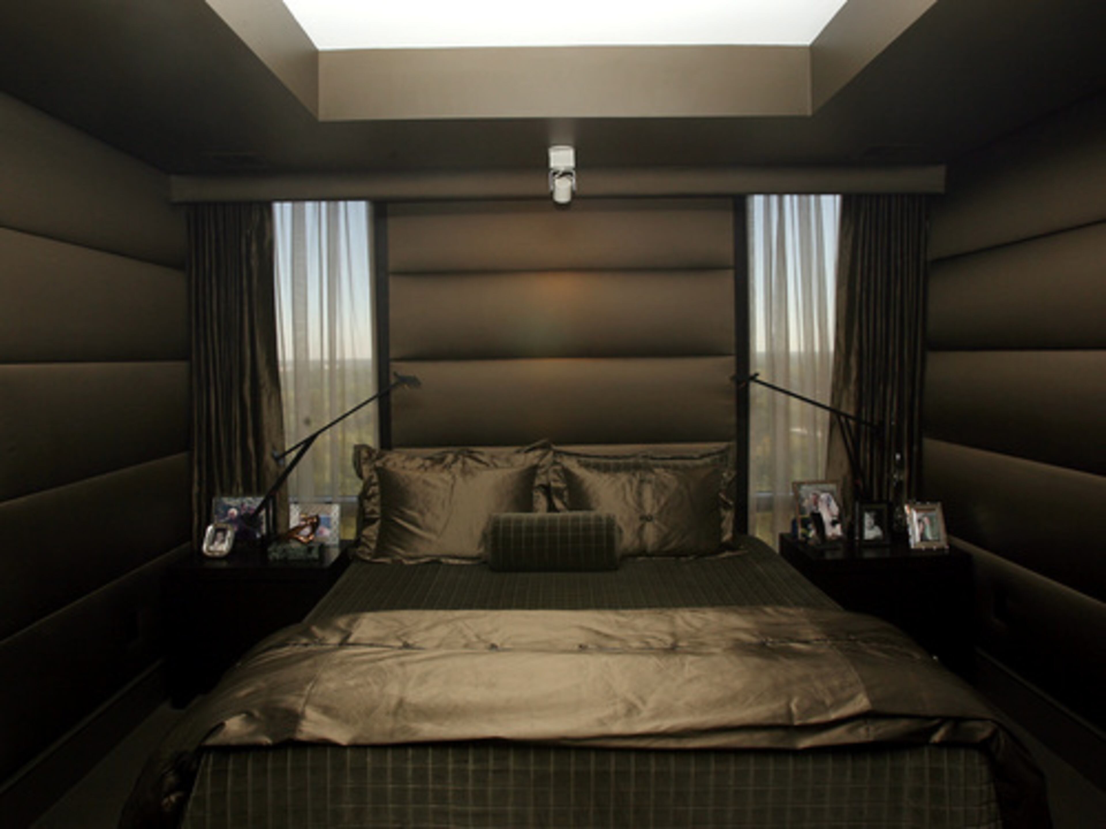 The master bedroom is done in bold grays and silk.