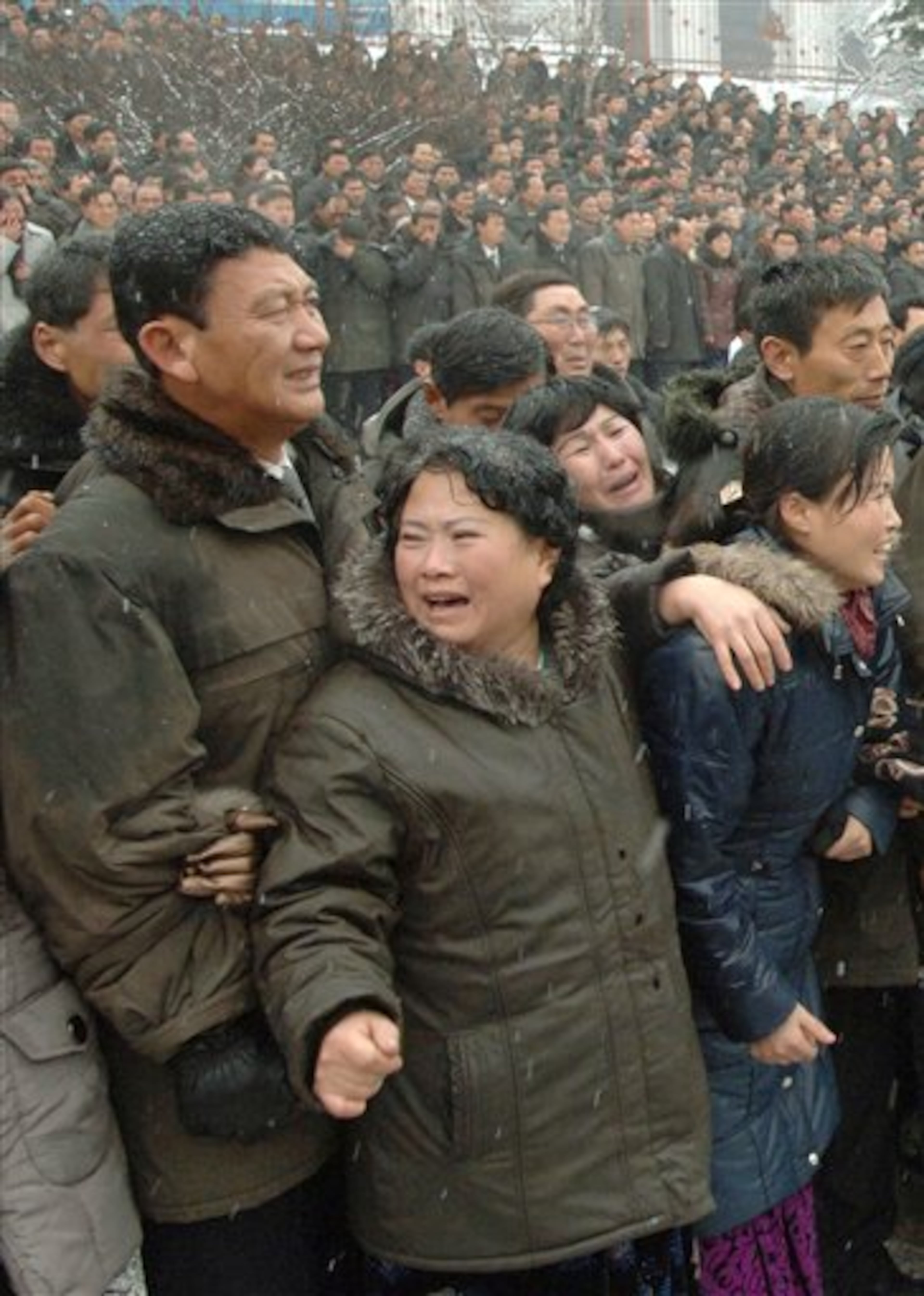 In this image made from KRT video, mourners cry during a funeral procession for late North Korean leader Kim Jong Il in snowy Pyongyang, North Korea, Wednesday, Dec. 28, 2011. (AP Photo/KRT via APTN)
