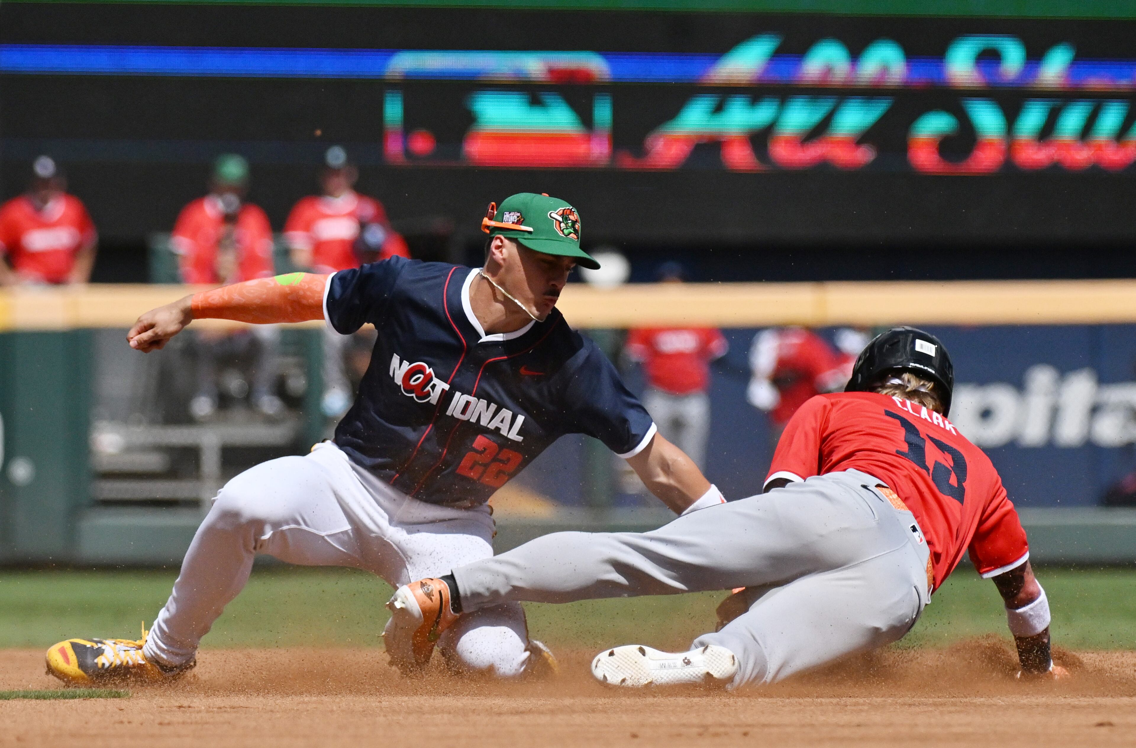 American League outfielder Max Clark (13) of the Detroit Tigers slides into second base safely as National League second baseman Konnor Griffin (22) applies a late tag during the first inning of the All-Star Futures Game at Truist Park, Saturday, July 12, 2025, in Atlanta. National League won 4-2 over American League. (Hyosub Shin / AJC)