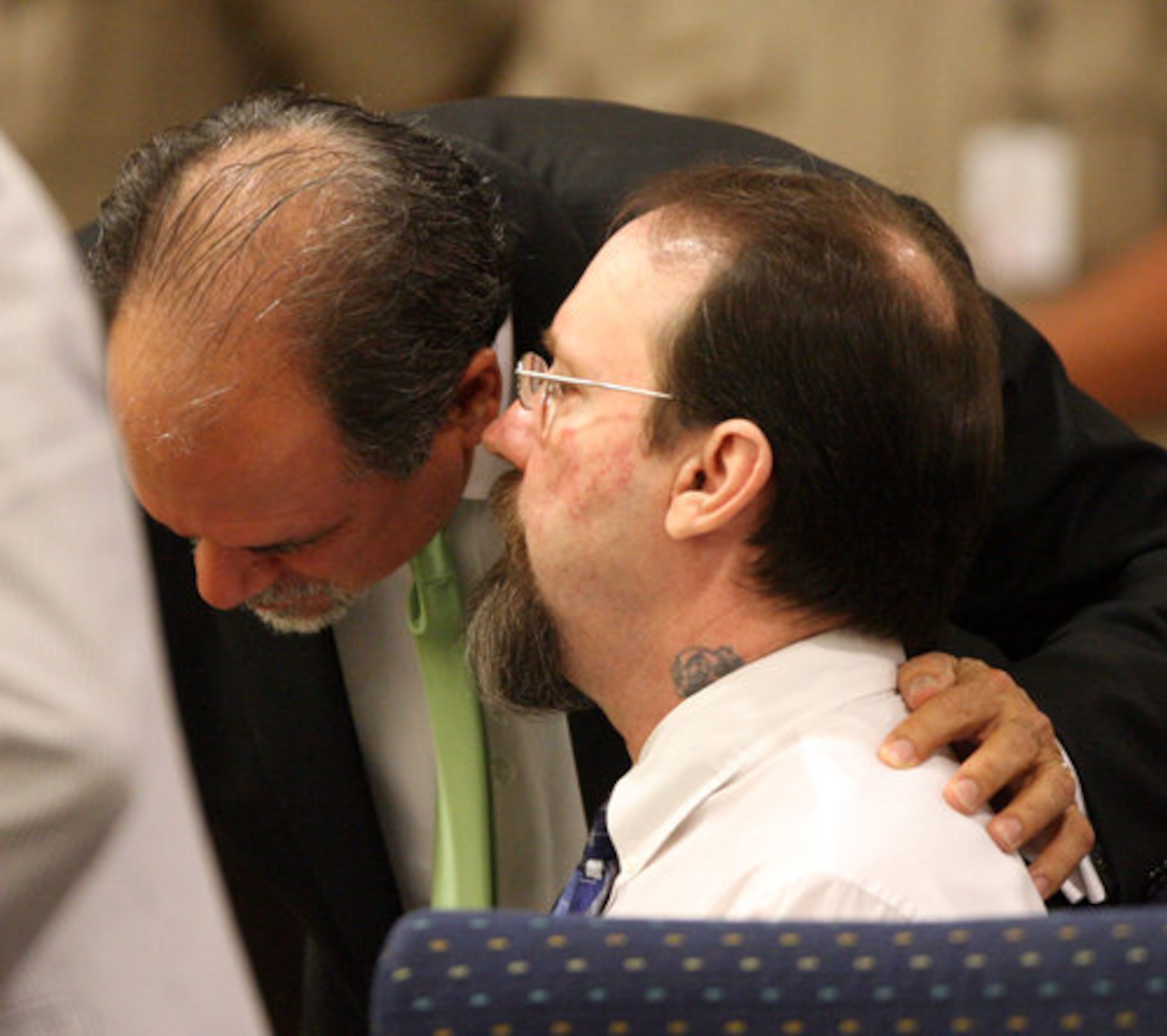 Michael Ledford (right) talks with his defense attorney Tom West during the sentencing phase of his murder trial.