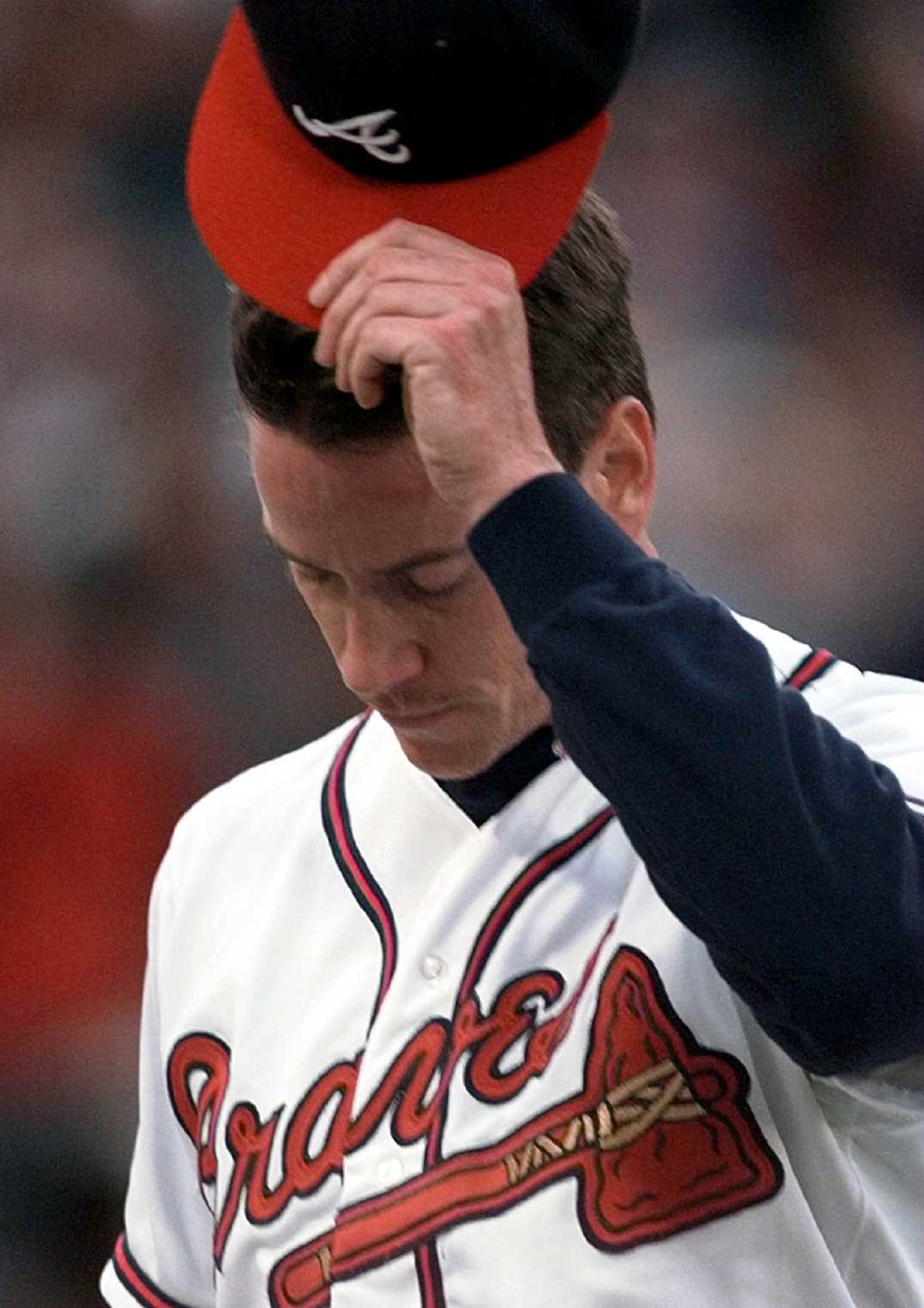 Take a look at photos of former Braves great Tom Glavine, who was elected into the Baseball Hall of fame Wednesday along with teammate Greg Maddux. The Braves' Tom Glavine acknowledges the crowd as he leaves the game during the National League Division Series in 1996. He was named series MVP as the Braves beat the Dodgers.