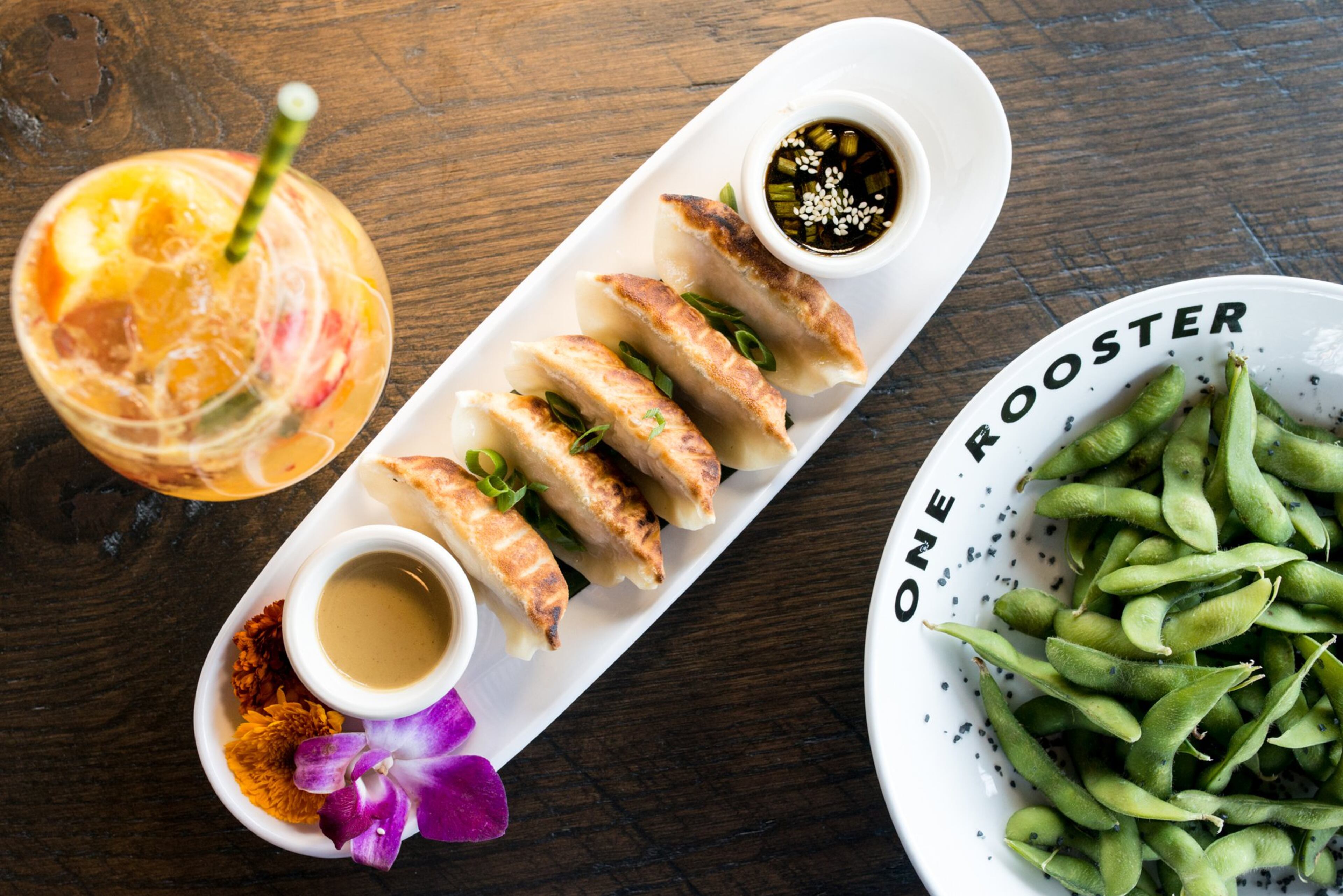 One Rooster edamame, pork and leek dumplings and Brett Ashley Smash cocktail. Photo credit - Mia Yakel.