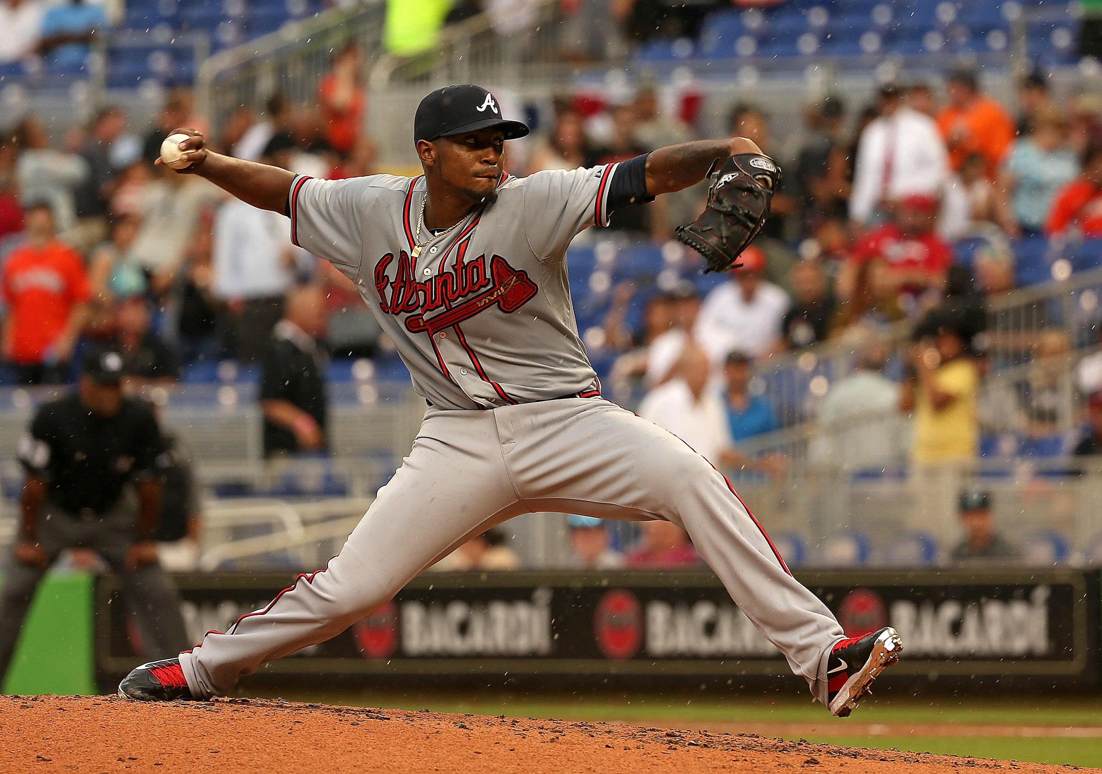 MIAMI, FL - APRIL 06: Julio Teheran #49 of the Atlanta Braves pitches during Opening Day against the Miami Marlins at Marlins Park on April 6, 2015 in Miami, Florida. (Photo by Mike Ehrmann/Getty Images)