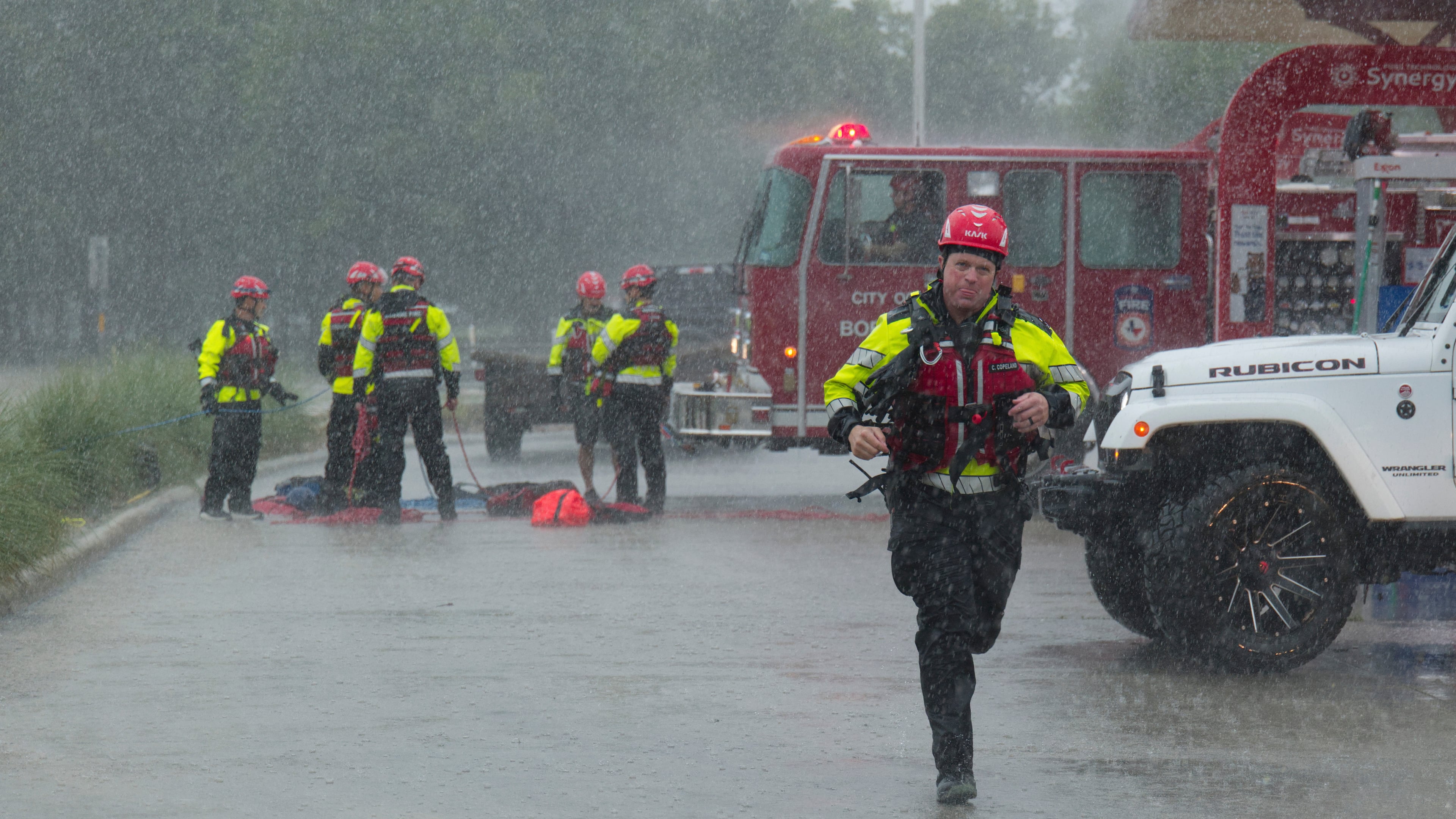 Members of the Boerne Fire Dept. prepare to perform a water rescue on Wednesday, July 15, 2026, in Boerne, Texas. (AP Photo/Darren Abate)
