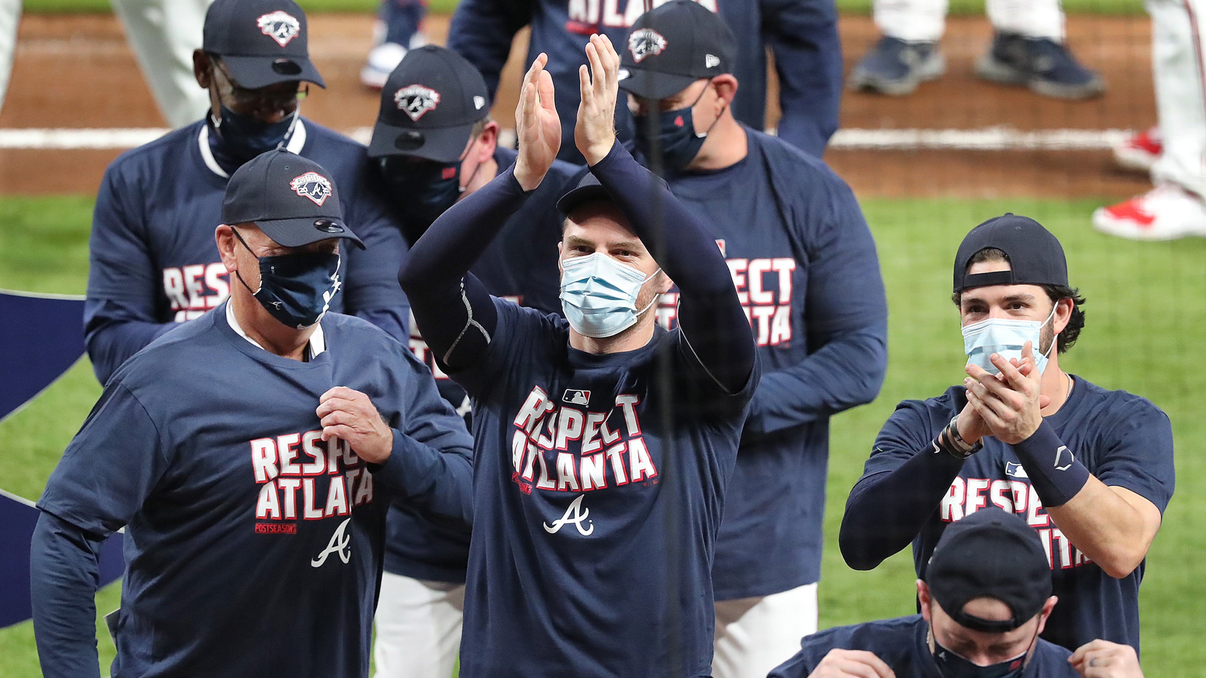 A strange look from a strange season: Masked Braves celebrate clinching another National League East title last Tuesday. (Curtis Compton/Atlanta Journal-Constitution/TNS)