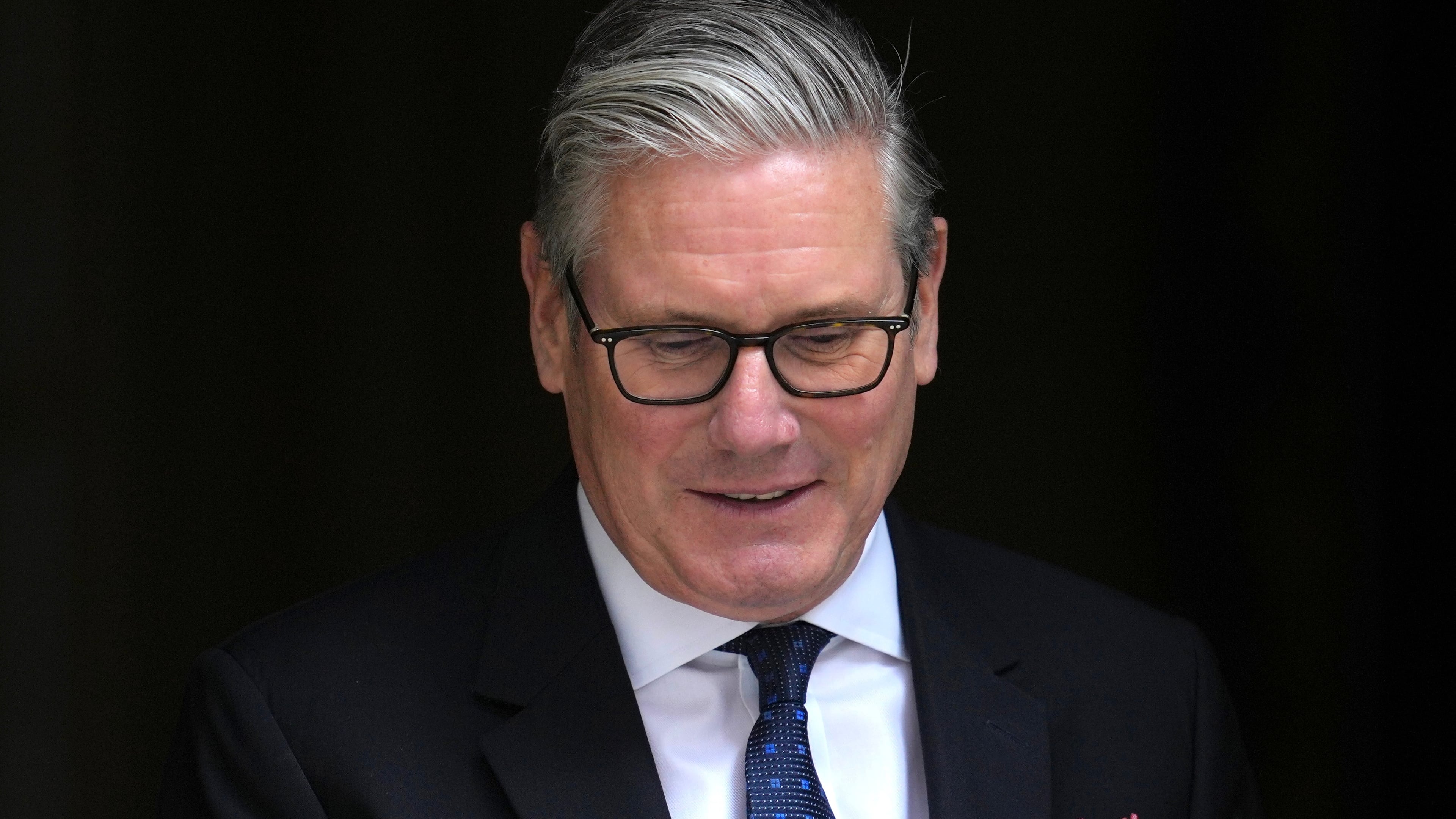Britain's Prime Minister Keir Starmer leaves 10 Downing Street to attend the weekly session of Prime Minister's Questions in parliament in London, Wednesday, June 10, 2026. (AP Photo/Kin Cheung)