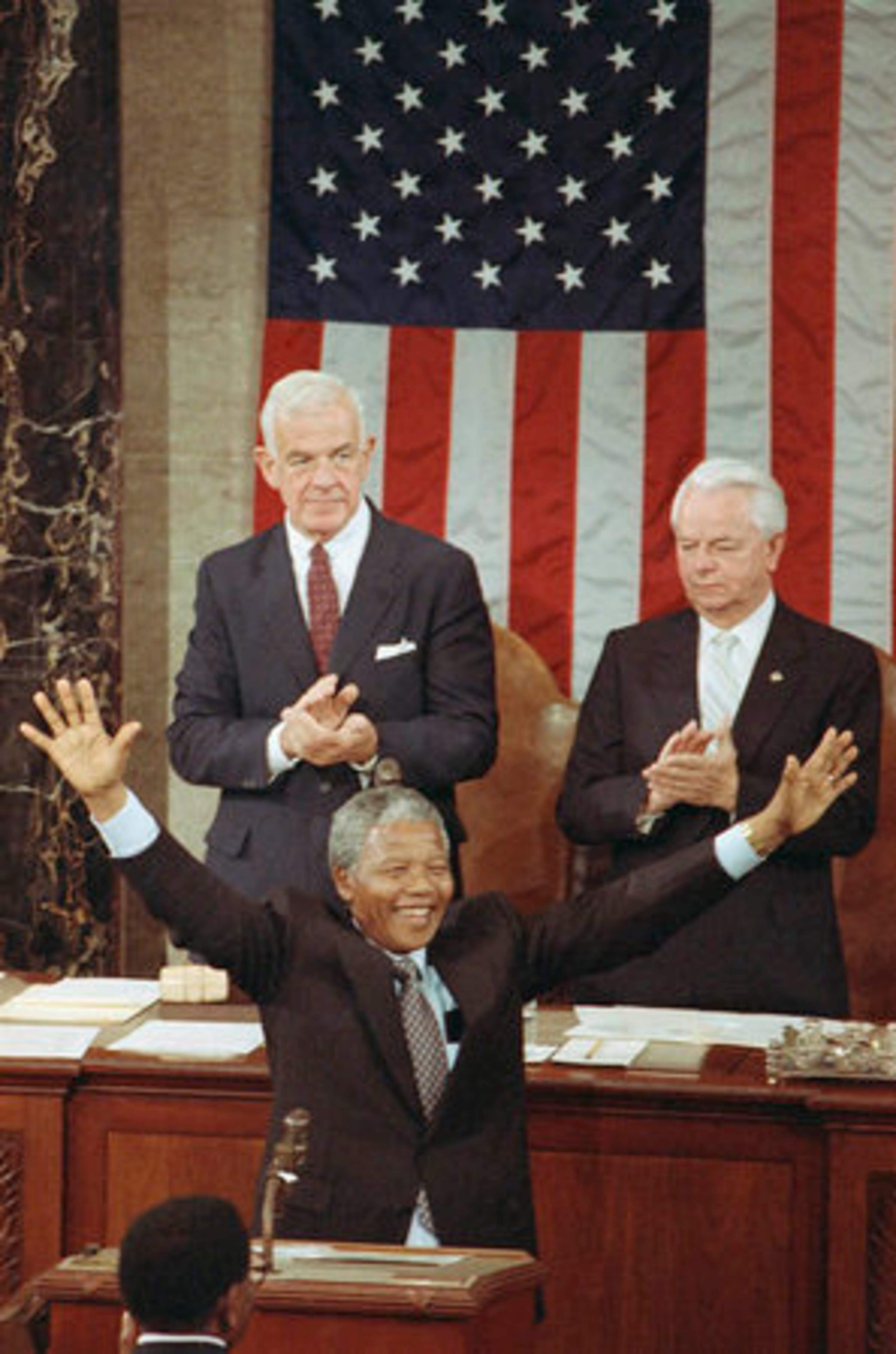 Mandela acknowledges applause as he stands before a Joint Meeting of Congress on Capitol Hill in Washington on June 26, 1990.