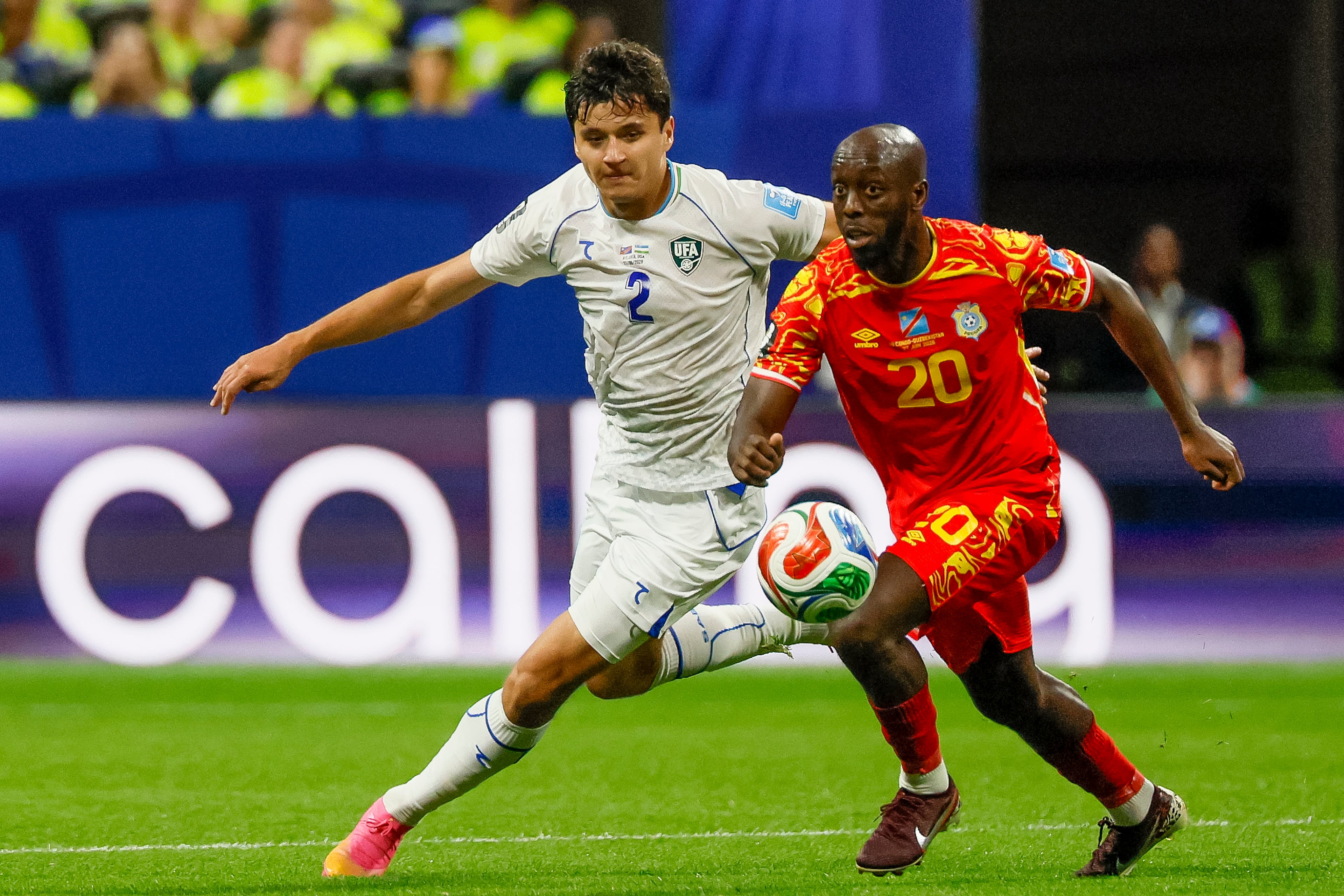 Uzbekistan defender Abdukodir Khusanov (left) chases Congo forward Yoane Wissa (right) across midfield during the first half of a FIFA World Cup match at Atlanta Stadium (Mercedes-Benz Stadium) on Saturday, June 27, 2026, in Atlanta. (Miguel Martinez/AJC)