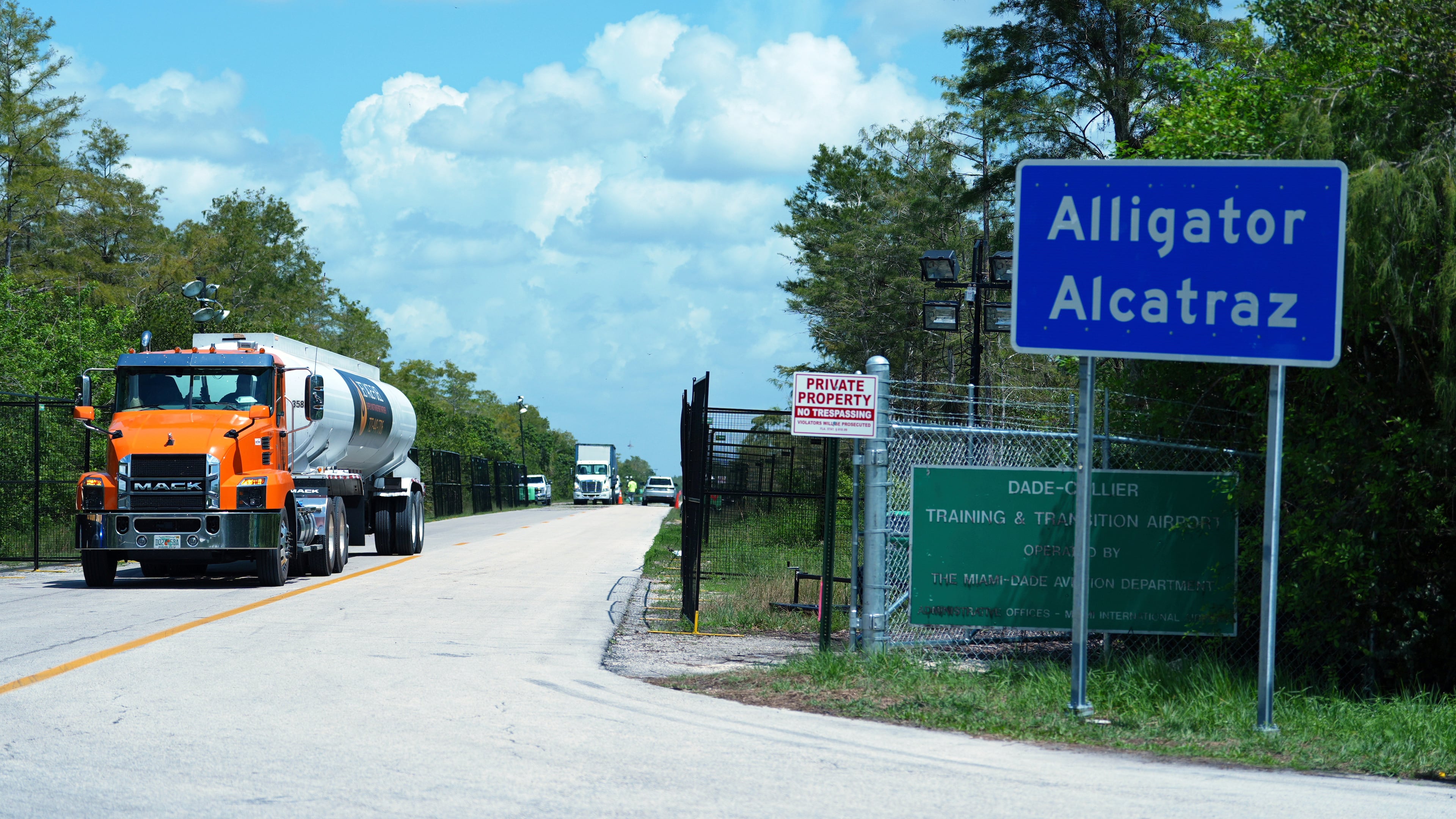 FILE - Trucks come and go from the "Alligator Alcatraz" immigration detention center in the Florida Everglades, Aug. 28, 2025, in Collier County, Fla. (AP Photo/Rebecca Blackwell, File)