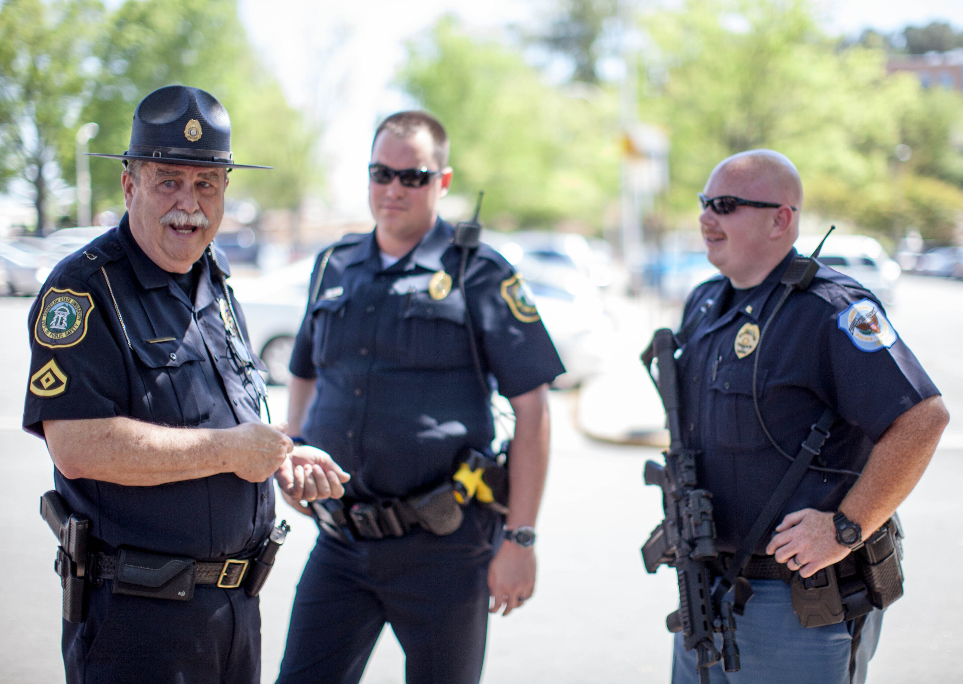 Police officers walk the campus of Kennesaw State University looking for a suspected gunman during a lockdown Friday, April 25, 2014. (BRANDEN CAMP/SPECIAL)