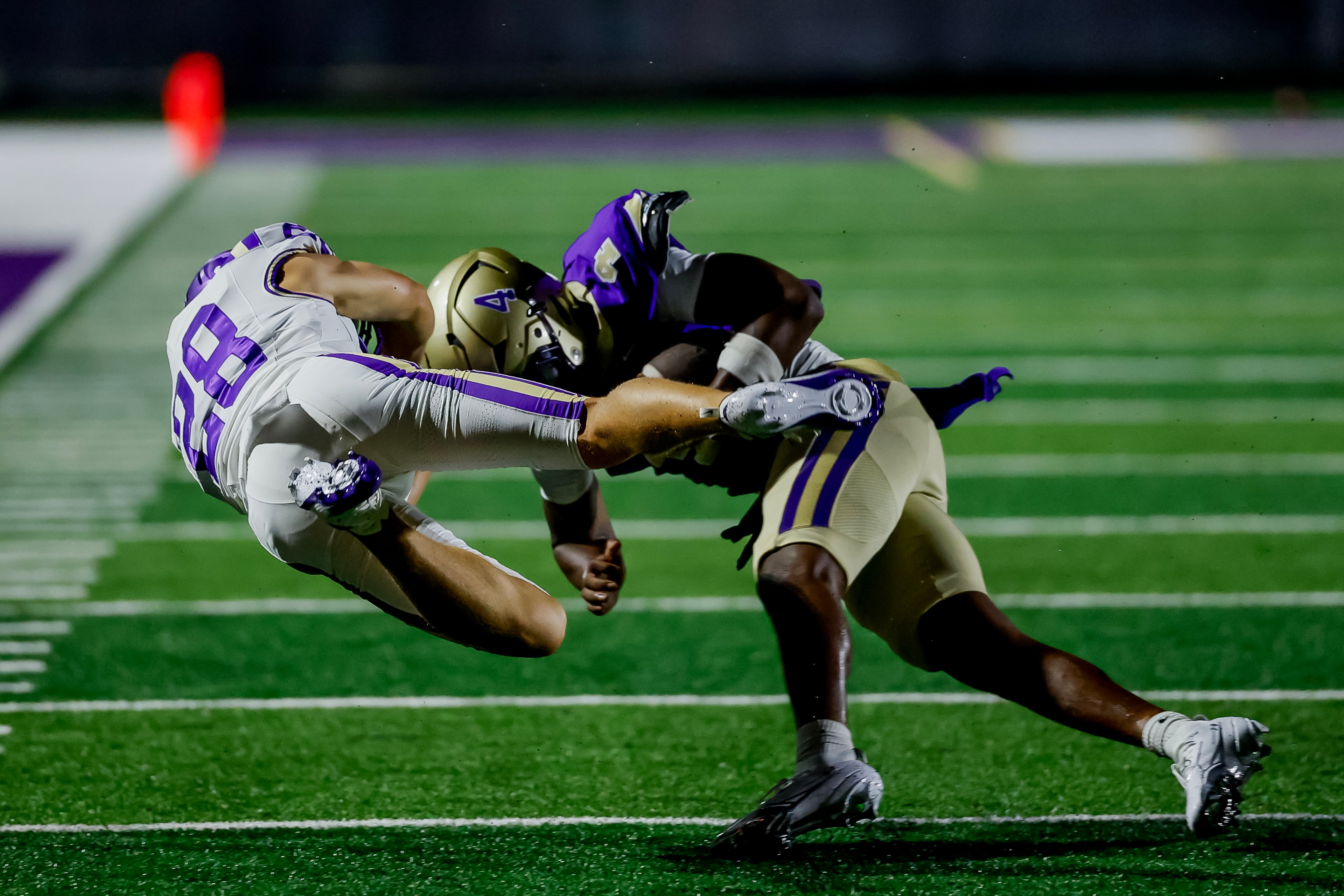 Cartersville defensive back Jacob Sanders (left) tackles Hiram running back Josiah Reed on Friday, Aug. 21, 2026, in Hiram. (Erik S. Lesser for the AJC)