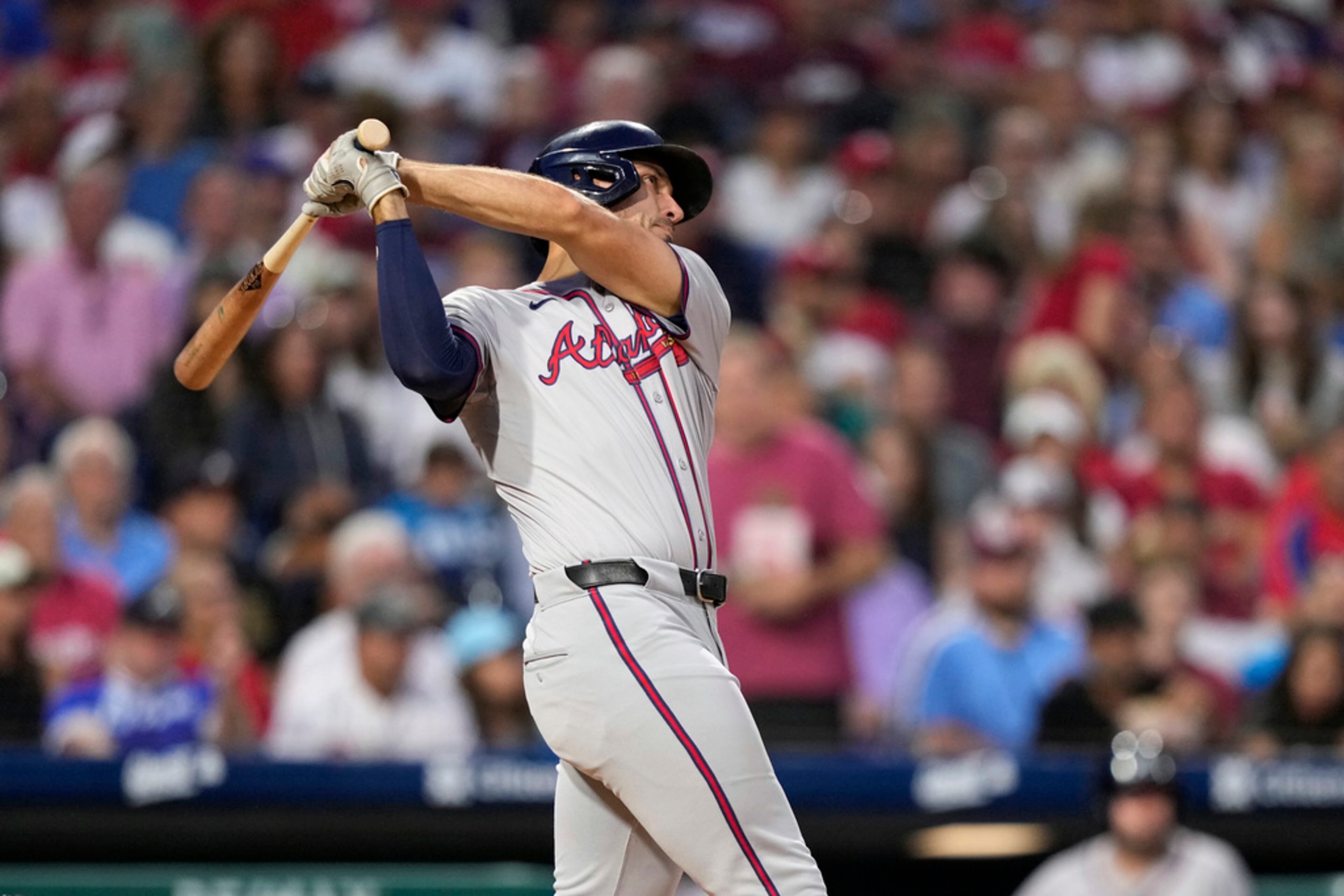 Atlanta Braves' Matt Olson follows through after hitting a two-run home run against Philadelphia Phillies pitcher Cristopher Sánchez during the third inning of a baseball game, Thursday, Aug. 29, 2024, in Philadelphia. (AP Photo/Matt Slocum)