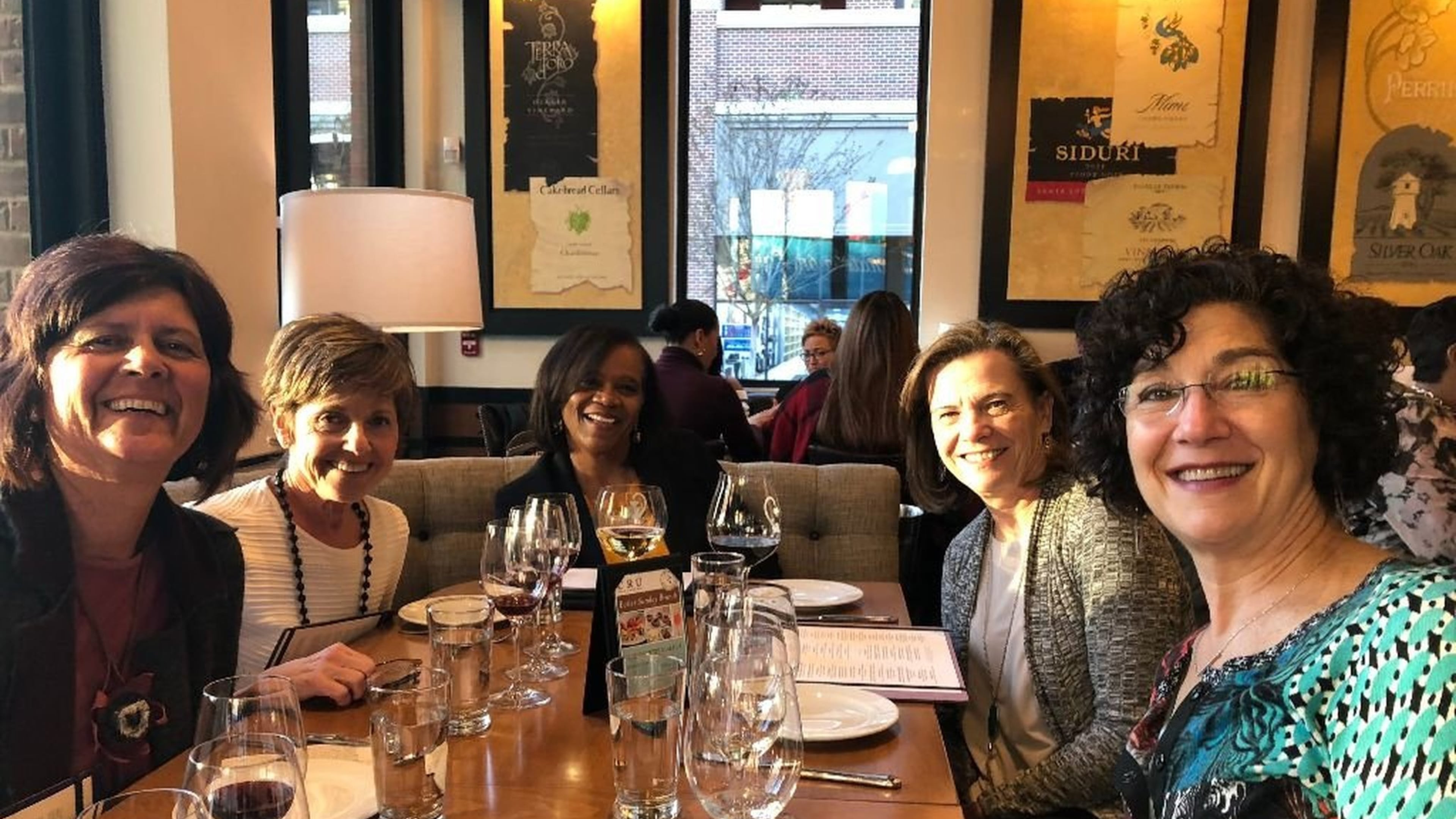 Gail Collier-Glover (center) enjoys a happy hour outing with other members of the Transition Network: (from left) Lynn Anderson, Alyse Pribish, Bonnie Cole and Debbie Cohen Levy. CONTRIBUTED