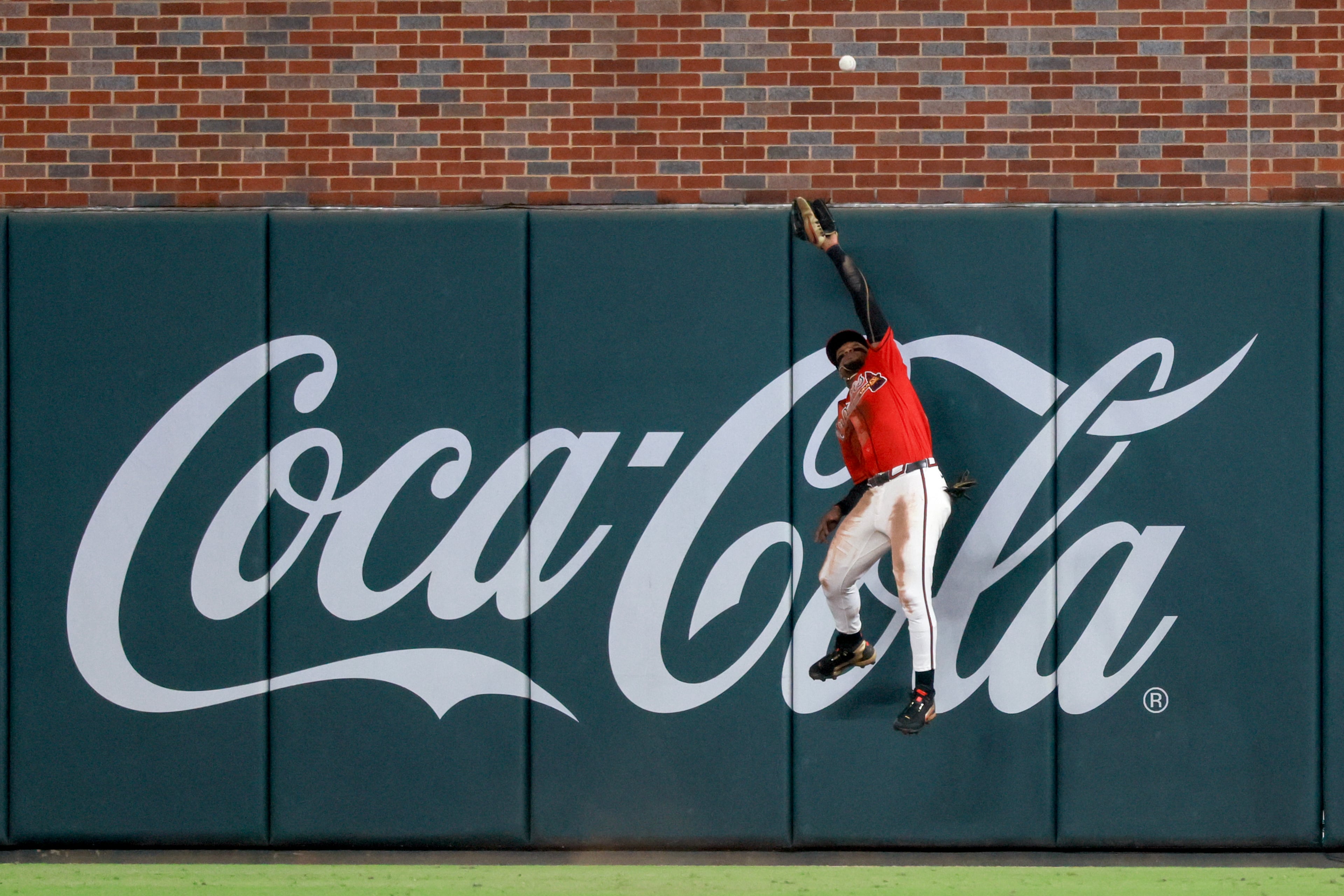 Atlanta Braves right fielder Ronald Acua Jr. (13) is unable to catch a triple hit by Philadelphia PhilliesÕ Derek Hill during the eighth inning of Game 3 of a MLB National League Wild Card playoff series between the Atlanta Braves and the Philadelphia Phillies, Thursday, Oct. 1, 2026, in Atlanta. (Jason Getz/AJC)