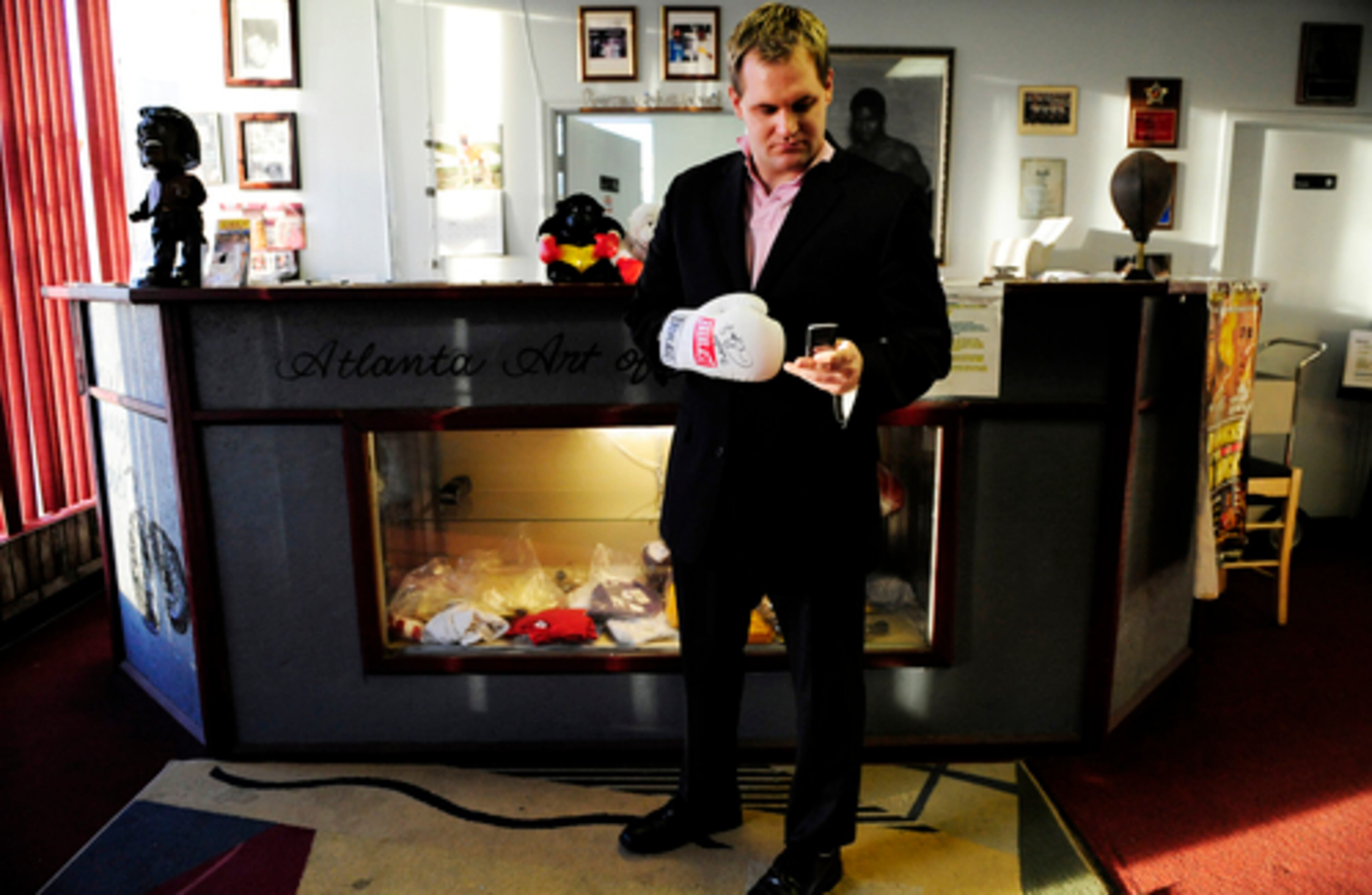 Punching numbers on a cellphone, Haliburton phones his father before training at the Atlanta Art of Boxing Center.
