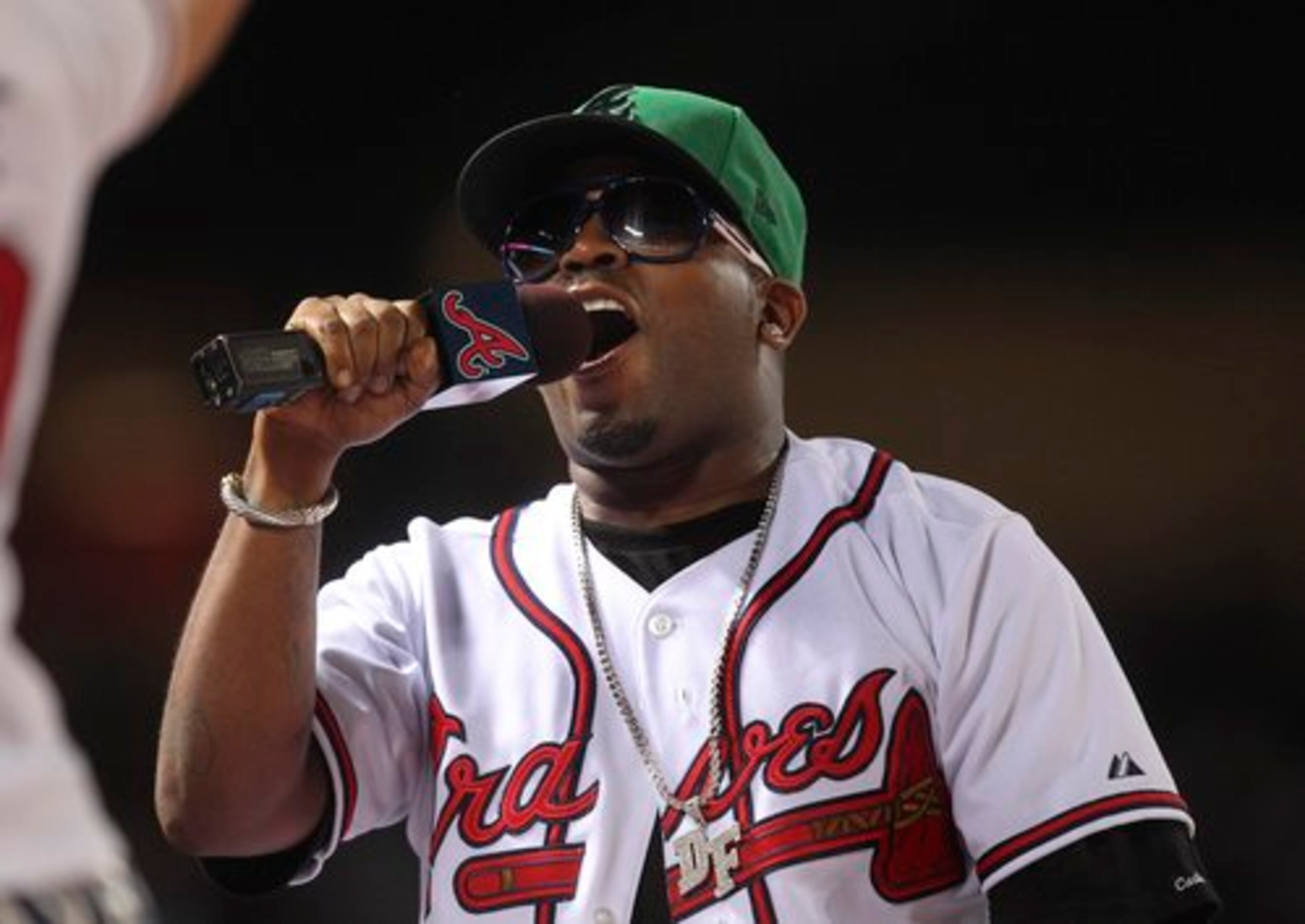 I WILL NOT DO 'THANK GOD I'M A COUNTRY BOY,' NO MATTER HOW MUCH YOU PAY ME: Big Boi sings "Take Me Out to the Ballgame" during the seventh inning stretch of the Braves-Rays game at Turner Field.