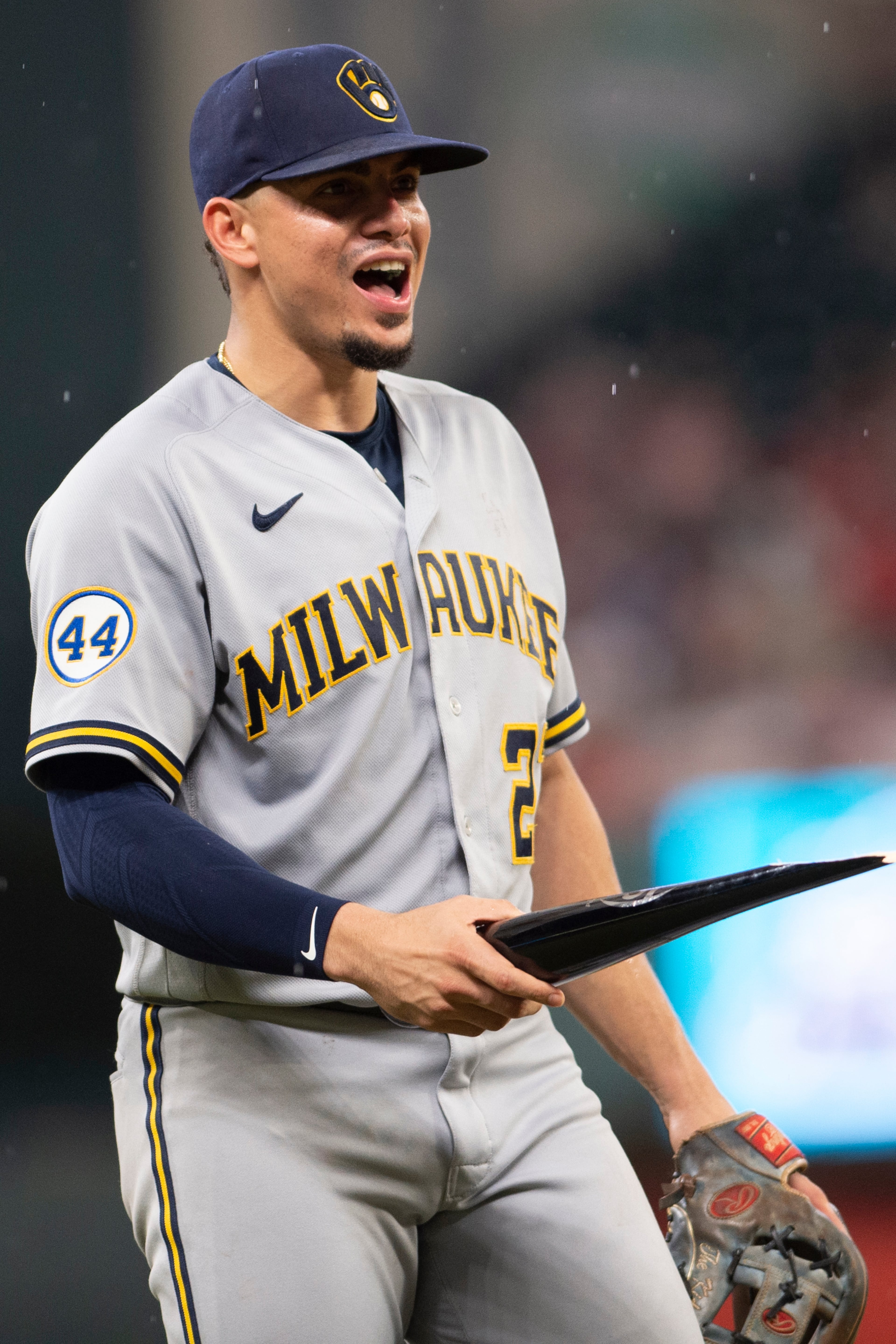 Milwaukee Brewers shortstop Willy Adames (27) picks up broken during a baseball game against the Atlanta Braves, Friday, July 30, 2021, in Atlanta. (AP Photo/Hakim Wright Sr.)